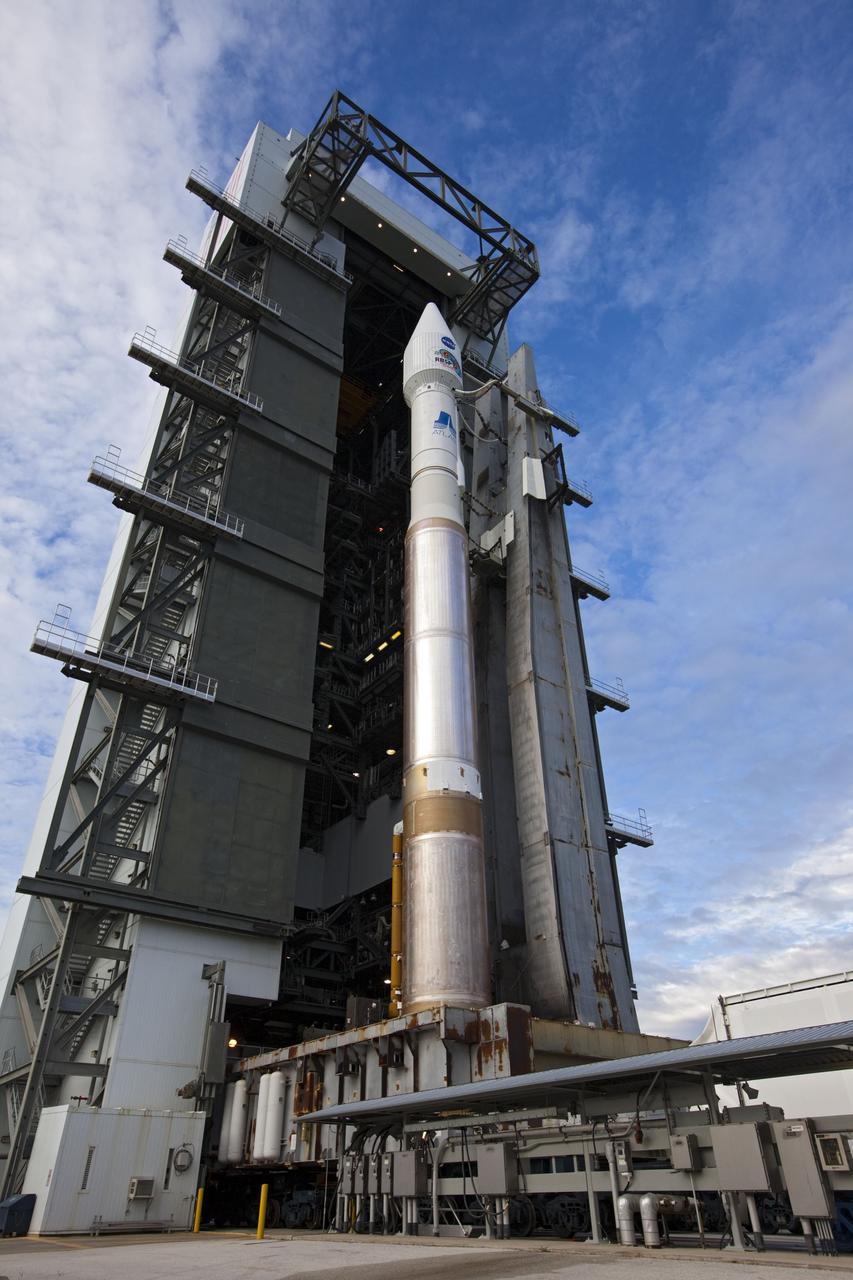 CAPE CANAVERAL, Fla. – The United Launch Alliance Atlas V rocket  with the Radiation Belt Storm Probes, or RBSP, spacecraft aboard is readied for rollout to the launch pad at Space Launch Complex 41 at Cape Canaveral Air Force Station. NASA’s RBSP mission will help researchers understand the sun’s influence on Earth and near-Earth space by studying the Earth’s radiation belts on various scales of space and time. RBSP will begin its mission of exploration of Earth’s Van Allen radiation belts and the extremes of space weather after its launch aboard an Atlas V rocket. Launch is targeted for Aug. 24. Photo credit: NASA/Kim Shiflett