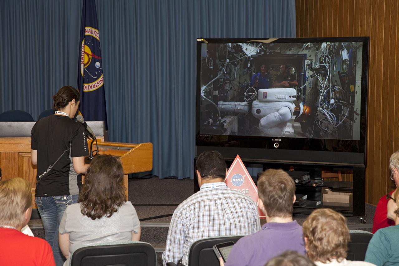 CAPE CANAVERAL, Fla. -- At NASA's Kennedy Space Center in Florida, social media participant Evie Marmon asks a question of space station flight engineer Suni Williams. Marmon is among those taking part in a question and answer session with astronauts aboard the International Space Station.      The social media gathering at the Florida spaceport took place Aug. 22, 2012 joining a world-wide NASA Social allowing participants to ask questions of NASA astronauts who are living and working aboard the International Space Station. . For more information, visit http://www.nasa.gov/mission_pages/station/main/index.html Photo credit: NASA/ Frankie Martin