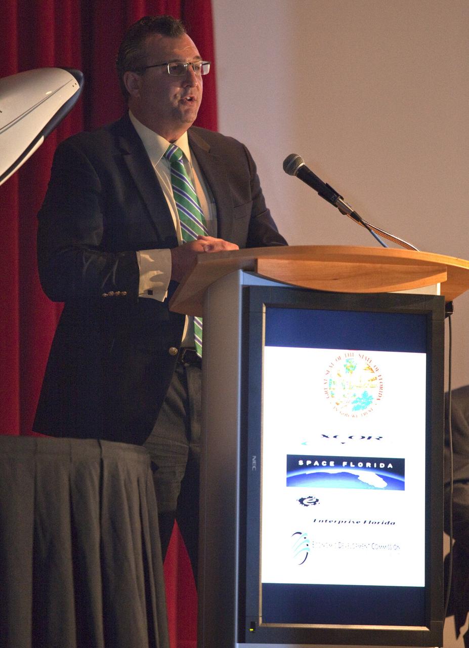 CAPE CANAVERAL, Fla. - At NASA's Kennedy Space Center in Florida, Todd Lindner, senior manager of Aviation Planning and Spaceport Development for the Jacksonville Aviation Authority, addresses guests at a presentation during which XCOR Aerospace announced plans to open a manufacturing operation in Brevard. The company's suborbital Lynx Mark II spacecraft possibly will take off and land at Kennedy's shuttle landing facility. XCOR Aerospace is a small, privately held California corporation with focus on the research, development, project management and production of reusable launch vehicles, rocket engines and rocket propulsion systems. XCOR will focus on space tourism, experimental flights and launching satellites. Photo credit: NASA/ Frankie Martin