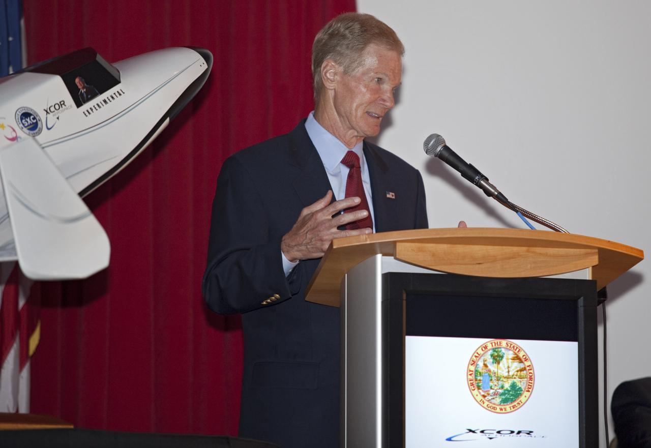 CAPE CANAVERAL, Fla. - At NASA's Kennedy Space Center in Florida, U.S. Sen. Bill Nelson D-Fla. addresses guests at a presentation during which XCOR Aerospace announced plans to open a manufacturing operation in Brevard.      The company's suborbital Lynx Mark II spacecraft possibly will take off and land at Kennedy's shuttle landing facility. XCOR Aerospace is a small, privately held California corporation with focus on the research, development, project management and production of reusable launch vehicles, rocket engines and rocket propulsion systems. XCOR will focus on space tourism, experimental flights and launching satellites. Photo credit: NASA/ Frankie Martin