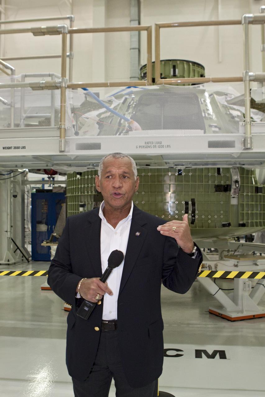 CAPE CANAVERAL, Fla. - In the Operations and Checkout Building at the Kennedy Space Center in Florida, NASA Administrator Charles Bolden addresses news media in front of the Orion EFT-1 spacecraft. Bolden took a few dozen members of the news media on a tour of the space agency's Kennedy Space Center and adjacent Cape Canaveral Air Force Station on Aug. 23, 2012 to show the progress being made for future government and commercial space endeavors that will begin from Florida's Space Coast. For more information, visit: http://www.nasa.gov/centers/kennedy/news/kennedy-bolden-tour.html Photo credit: NASA/Kim Shiflett