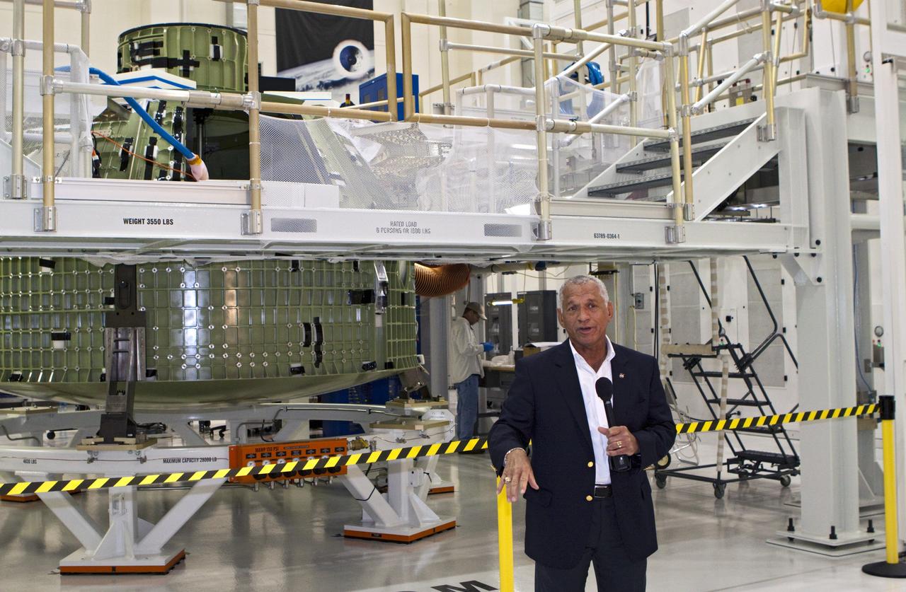 CAPE CANAVERAL, Fla. - In the Operations and Checkout Building at the Kennedy Space Center in Florida, NASA Administrator Charles Bolden addresses news media in front of the Orion EFT-1 spacecraft. Bolden took a few dozen members of the news media on a tour of the space agency's Kennedy Space Center and adjacent Cape Canaveral Air Force Station on Aug. 23, 2012 to show the progress being made for future government and commercial space endeavors that will begin from Florida's Space Coast. For more information, visit: http://www.nasa.gov/centers/kennedy/news/kennedy-bolden-tour.html Photo credit: NASA/Kim Shiflett