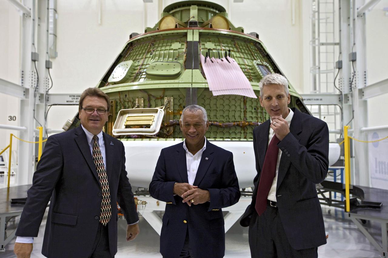 CAPE CANAVERAL, Fla. - In the Operations and Checkout Building at the Kennedy Space Center in Florida, NASA Administrator Charles Bolden, center, addresses news media in front of the Orion EFT-1 spacecraft. Also participating are Jules Schneider, senior manager of Project Engineering for the Lockheed Martin Orion Program at Kennedy, left, and Scott Wilson, NASA's manager of Production Operations for the Orion Program. Bolden took a few dozen members of the news media on a tour of the space agency's Kennedy Space Center and adjacent Cape Canaveral Air Force Station on Aug. 23, 2012 to show the progress being made for future government and commercial space endeavors that will begin from Florida's Space Coast. For more information, visit: http://www.nasa.gov/centers/kennedy/news/kennedy-bolden-tour.html Photo credit: NASA/Kim Shiflett