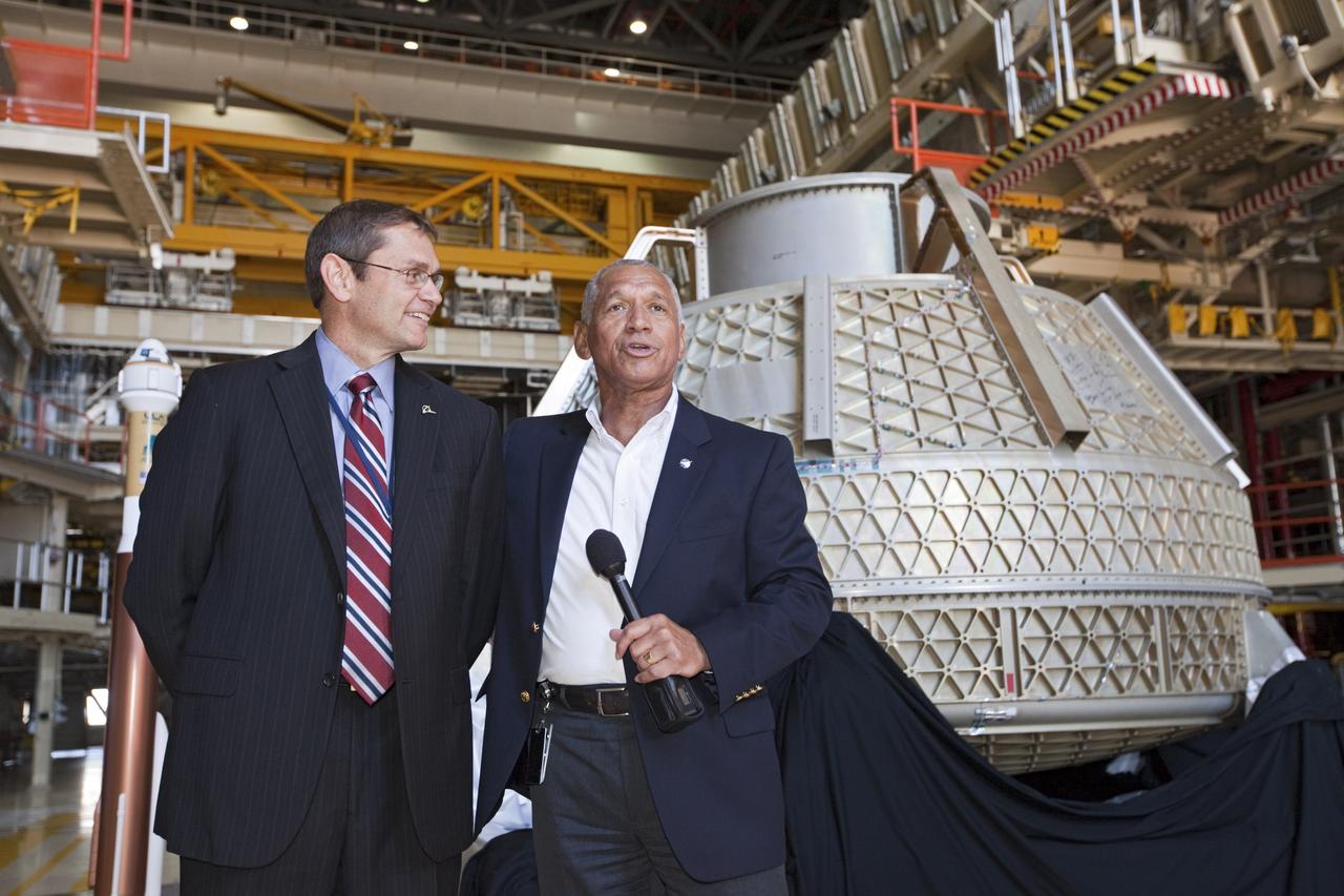 CAPE CANAVERAL, Fla. – NASA Administrator Charlie Bolden, right, and Boeing's Vice President and General Manager of Space Exploration John Elbon address the media inside Orbiter Processing Facility-3, or OPF-3, at NASA's Kennedy Space Center in Florida. Bolden took a few dozen media on a road show tour of the center and adjacent Cape Canaveral Air Force Station to show the progress being made for future government and commercial space endeavors that will begin from Florida's Space Coast. Boeing is leasing OPF-3 through an agreement with Space Florida for the manufacturing and assembly of its CST-100 spacecraft, which is under development in collaboration with NASA's Commercial Crew Program. During his tour, Bolden announced that Space Exploration Technologies, or SpaceX, has completed its Space Act Agreement with NASA for Commercial Orbital Transportation Services. SpaceX is scheduled to launch the first of its 12 contracted cargo flights to the space station from Cape Canaveral this October, under NASA’s Commercial Resupply Services Program. Bolden also announced NASA partner Sierra Nevada Corp. has conducted its first milestone under the agency’s recently announced Commercial Crew Integrated Capability CCiCap initiative. The milestone, a program implementation plan review, marks an important first step in Sierra Nevada’s efforts to develop a crew transportation system with its Dream Chaser spacecraft. Through NASA’s commercial space initiatives and programs, the agency is providing investments to stimulate the American commercial space industry. Photo credit: NASA/Kim Shiflett