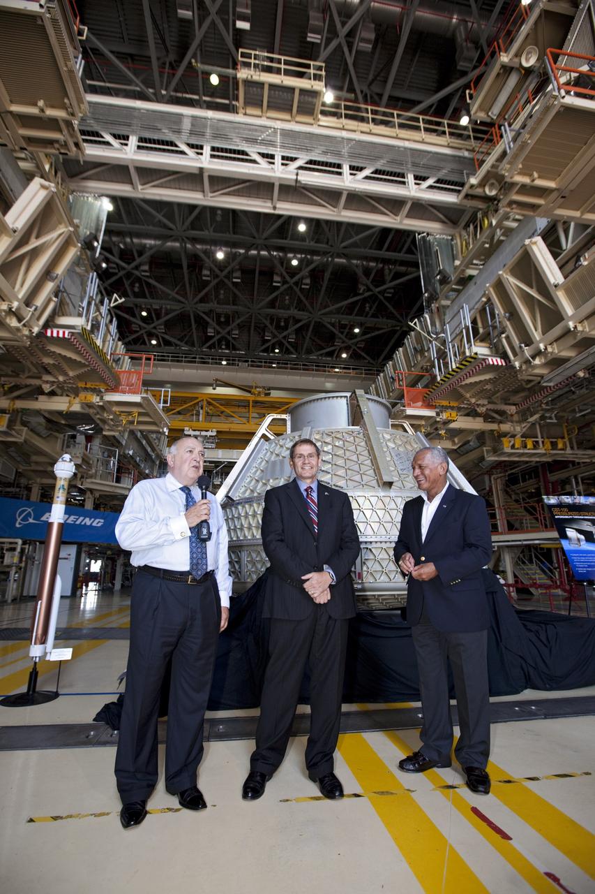 CAPE CANAVERAL, Fla. – Space Florida President Frank DiBello, NASA Administrator Charlie Bolden, and Boeing's Vice President and General Manager of Space Exploration John Elbon address the media inside Orbiter Processing Facility-3, or OPF-3, at NASA's Kennedy Space Center in Florida. Bolden took a few dozen media on a road show tour of the center and adjacent Cape Canaveral Air Force Station to show the progress being made for future government and commercial space endeavors that will begin from Florida's Space Coast. Boeing is leasing OPF-3 through an agreement with Space Florida for the manufacturing and assembly of its CST-100 spacecraft, which is under development in collaboration with NASA's Commercial Crew Program. During his tour, Bolden announced that Space Exploration Technologies, or SpaceX, has completed its Space Act Agreement with NASA for Commercial Orbital Transportation Services. SpaceX is scheduled to launch the first of its 12 contracted cargo flights to the space station from Cape Canaveral this October, under NASA’s Commercial Resupply Services Program. Bolden also announced NASA partner Sierra Nevada Corp. has conducted its first milestone under the agency’s recently announced Commercial Crew Integrated Capability CCiCap initiative. The milestone, a program implementation plan review, marks an important first step in Sierra Nevada’s efforts to develop a crew transportation system with its Dream Chaser spacecraft. Through NASA’s commercial space initiatives and programs, the agency is providing investments to stimulate the American commercial space industry. Photo credit: NASA/Kim Shiflett
