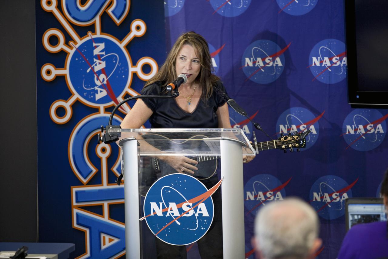 CAPE CANAVERAL, Fla. – At NASA's Kennedy Space Center in Florida, Beth Nielson Chapman performs "The Mighty Night Sky" for agency social media followers during the second day of NASA Social activities revolving around NASA's Radiation Belt Storm Probes, or RBSP, mission. The probes are set to launch aboard a United Launch Alliance, or ULA, Atlas V rocket from nearby Cape Canaveral Air Force Station. About 40 followers were selected to participate in RBSP's prelaunch and launch activities.        The RBSP mission will help us understand the sun’s influence on Earth and near-Earth space by studying the Earth’s radiation belts on various scales of space and time. RBSP will begin its mission of exploration of Earth’s Van Allen radiation belts and the extremes of space weather. For more information, visit http://www.nasa.gov/rbsp. Photo credit: NASA/Frankie Martin
