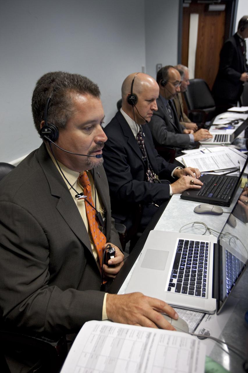 CAPE CANAVERAL, Fla. – NASA Launch Services Program officials oversee the countdown of NASA's Radiation Belt Storm Probes, or RBSP, and its United Launch Alliance Atlas V rocket from consoles in the Atlas V Spaceflight Operations Center on Cape Canaveral Air Force Station in Florida. From left are Omar Baez, assistant launch manager for RBSP, Tim Dunn, launch manager for RBSP, and Albert Sierra, chief of the Flight Projects Office. Weather conditions associated with lightning, as well as cumulus and anvil clouds, kept the probes on Space Launch Complex 41 for the duration of the 20-minute launch window which opened at 4:07 a.m. EDT.    RBSP will explore changes in Earth's space environment caused by the sun -- known as "space weather" -- that can disable satellites, create power-grid failures and disrupt GPS service. The mission also will provide data on the fundamental radiation and particle acceleration processes throughout the universe. The launch is rescheduled for 4:05 a.m. EDT on Aug. 30, pending approval from the range.  For more information on RBSP, visit http://www.nasa.gov/rbsp.  Photo credit: NASA/Kim Shiflett