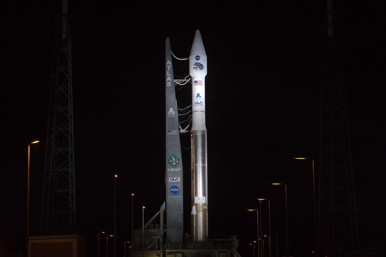 CAPE CANAVERAL, Fla. – At Cape Canaveral Air Force Station in Florida, the United Launch Alliance Atlas V rocket, carrying NASA’s twin Radiation Belt Storm Probes, or RBSP, is rolled back from Space Launch Complex 41 to the Vertical Integration Facility where they will be secured and protected from inclement weather due to Tropical Storm Isaac.    RBSP will explore changes in Earth's space environment caused by the sun -- known as "space weather" -- that can disable satellites, create power-grid failures and disrupt GPS service. The mission also will provide data on the fundamental radiation and particle acceleration processes throughout the universe. The launch is rescheduled for 4:05 a.m. EDT on Aug. 30, pending approval from the range.  For more information on RBSP, visit http://www.nasa.gov/rbsp.  Photo credit: NASA/Ben Smegelsky