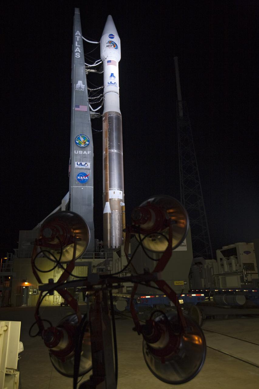 CAPE CANAVERAL, Fla. – At Cape Canaveral Air Force Station in Florida, the United Launch Alliance Atlas V rocket, carrying NASA’s twin Radiation Belt Storm Probes, or RBSP, is rolled back from Space Launch Complex 41 to the Vertical Integration Facility where they will be secured and protected from inclement weather due to Tropical Storm Isaac.    RBSP will explore changes in Earth's space environment caused by the sun -- known as "space weather" -- that can disable satellites, create power-grid failures and disrupt GPS service. The mission also will provide data on the fundamental radiation and particle acceleration processes throughout the universe. The launch is rescheduled for 4:05 a.m. EDT on Aug. 30, pending approval from the range.  For more information on RBSP, visit http://www.nasa.gov/rbsp.  Photo credit: NASA/Ben Smegelsky