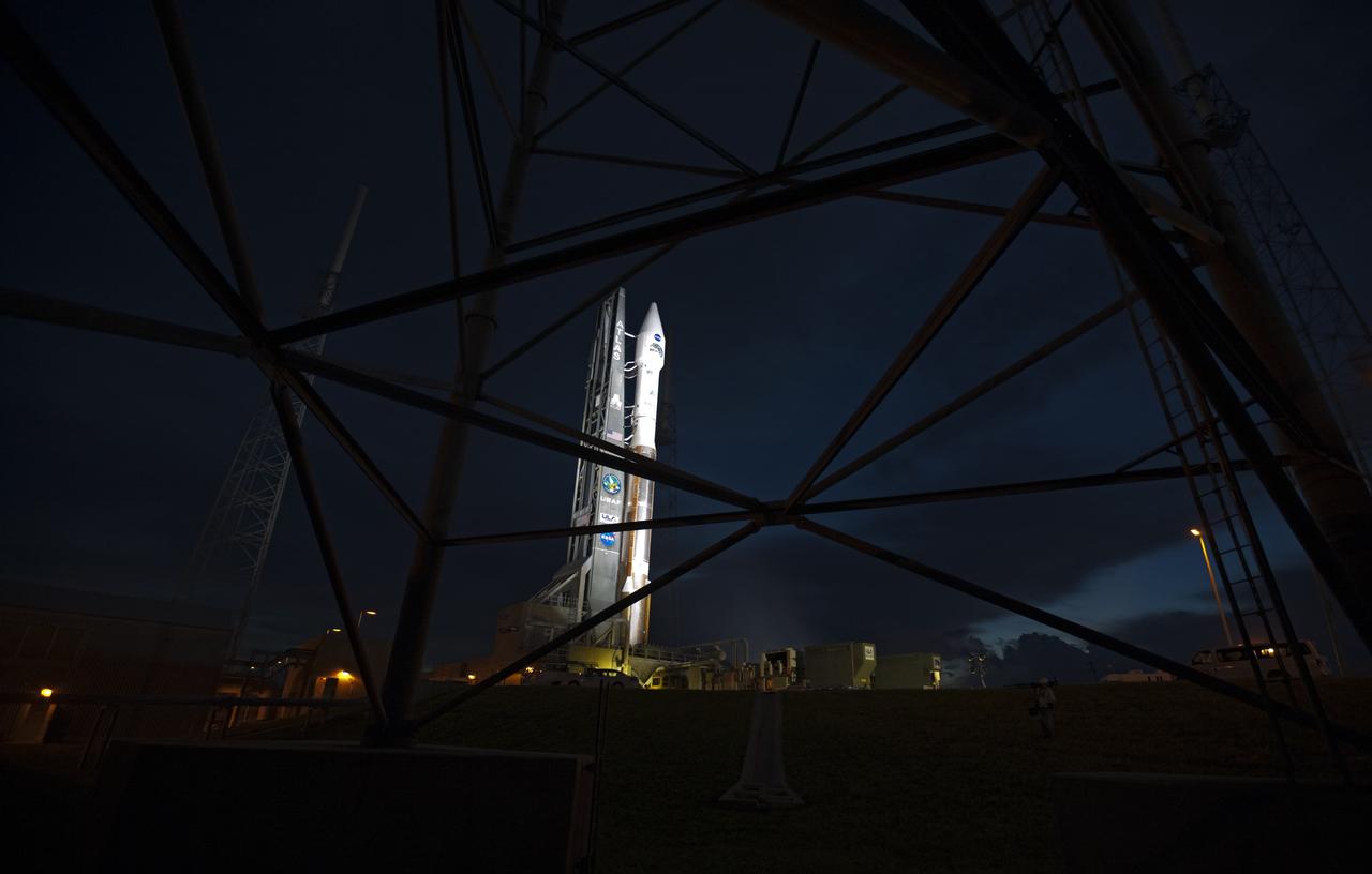 CAPE CANAVERAL, Fla. – At Cape Canaveral Air Force Station in Florida, the United Launch Alliance Atlas V rocket, carrying NASA’s twin Radiation Belt Storm Probes, or RBSP, is rolled back from Space Launch Complex 41 to the Vertical Integration Facility. The rocket and spacecraft will be secured and protected from inclement weather due to Tropical Storm Isaac.    RBSP will explore changes in Earth's space environment caused by the sun -- known as "space weather" -- that can disable satellites, create power-grid failures and disrupt GPS service. The mission also will provide data on the fundamental radiation and particle acceleration processes throughout the universe. The launch is rescheduled for 4:05 a.m. EDT on Aug. 30, pending approval from the range.  For more information on RBSP, visit http://www.nasa.gov/rbsp.  Photo credit: NASA/Ben Smegelsky