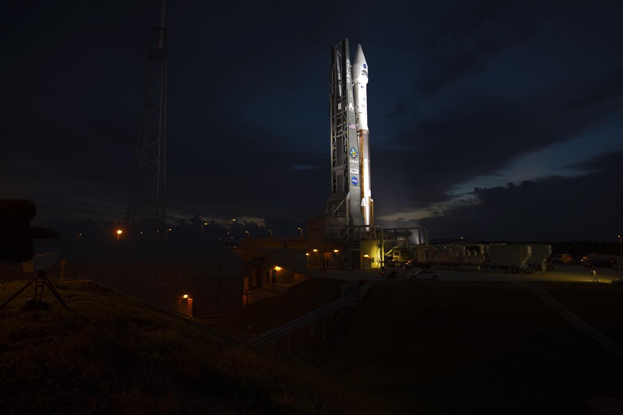 CAPE CANAVERAL, Fla. – At Cape Canaveral Air Force Station in Florida, the United Launch Alliance Atlas V rocket, carrying NASA’s twin Radiation Belt Storm Probes, or RBSP, is rolled back from Space Launch Complex 41 to the Vertical Integration Facility. The rocket and spacecraft will be secured and protected from inclement weather due to Tropical Storm Isaac.    RBSP will explore changes in Earth's space environment caused by the sun -- known as "space weather" -- that can disable satellites, create power-grid failures and disrupt GPS service. The mission also will provide data on the fundamental radiation and particle acceleration processes throughout the universe. The launch is rescheduled for 4:05 a.m. EDT on Aug. 30, pending approval from the range.  For more information on RBSP, visit http://www.nasa.gov/rbsp.  Photo credit: NASA/Ben Smegelsky