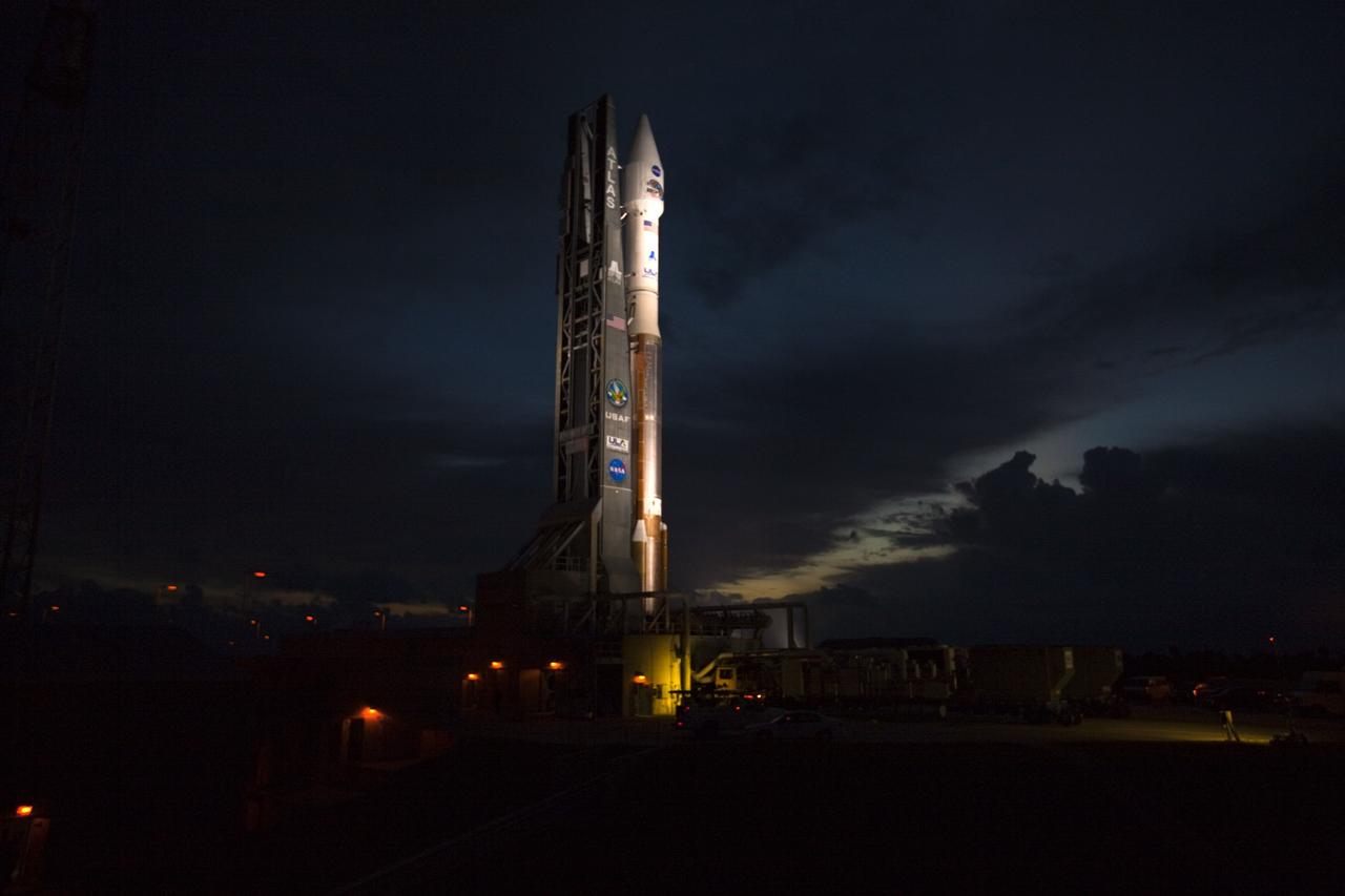 CAPE CANAVERAL, Fla. – At Cape Canaveral Air Force Station in Florida, the United Launch Alliance Atlas V rocket, carrying NASA’s twin Radiation Belt Storm Probes, or RBSP, is rolled back from Space Launch Complex 41 to the Vertical Integration Facility. The rocket and spacecraft will be secured and protected from inclement weather due to Tropical Storm Isaac.    RBSP will explore changes in Earth's space environment caused by the sun -- known as "space weather" -- that can disable satellites, create power-grid failures and disrupt GPS service. The mission also will provide data on the fundamental radiation and particle acceleration processes throughout the universe. The launch is rescheduled for 4:05 a.m. EDT on Aug. 30, pending approval from the range.  For more information on RBSP, visit http://www.nasa.gov/rbsp.  Photo credit: NASA/Ben Smegelsky