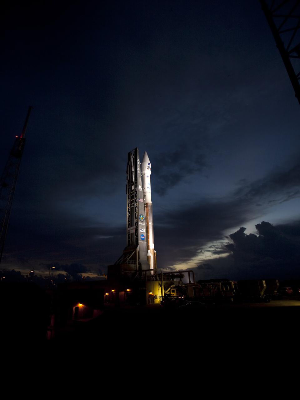 CAPE CANAVERAL, Fla. – At Cape Canaveral Air Force Station in Florida, the United Launch Alliance Atlas V rocket, carrying NASA’s twin Radiation Belt Storm Probes, or RBSP, is rolled back from Space Launch Complex 41 to the Vertical Integration Facility. The rocket and spacecraft will be secured and protected from inclement weather due to Tropical Storm Isaac.    RBSP will explore changes in Earth's space environment caused by the sun -- known as "space weather" -- that can disable satellites, create power-grid failures and disrupt GPS service. The mission also will provide data on the fundamental radiation and particle acceleration processes throughout the universe. The launch is rescheduled for 4:05 a.m. EDT on Aug. 30, pending approval from the range.  For more information on RBSP, visit http://www.nasa.gov/rbsp.  Photo credit: NASA/Ben Smegelsky