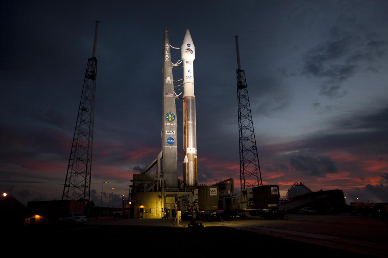 CAPE CANAVERAL, Fla. – An unfavorable weather forecast as a result of Tropical Storm Isaac approaching Florida kept NASA's twin Radiation Belt Storm Probes, or RBSP, on Space Launch Complex 41 at Cape Canaveral Air Force Station in Florida. Managers decided to roll the Atlas V rocket off the launch pad and back to the Vertical Integration Facility to ensure the launch vehicle and RBSP spacecraft are secured and protected from inclement weather.    RBSP will explore changes in Earth's space environment caused by the sun -- known as "space weather" -- that can disable satellites, create power-grid failures and disrupt GPS service. The mission also will provide data on the fundamental radiation and particle acceleration processes throughout the universe. The launch is rescheduled for 4:05 a.m. EDT on Aug. 30, pending approval from the range.  For more information on RBSP, visit http://www.nasa.gov/rbsp.  Photo credit: NASA/Ben Smegelsky