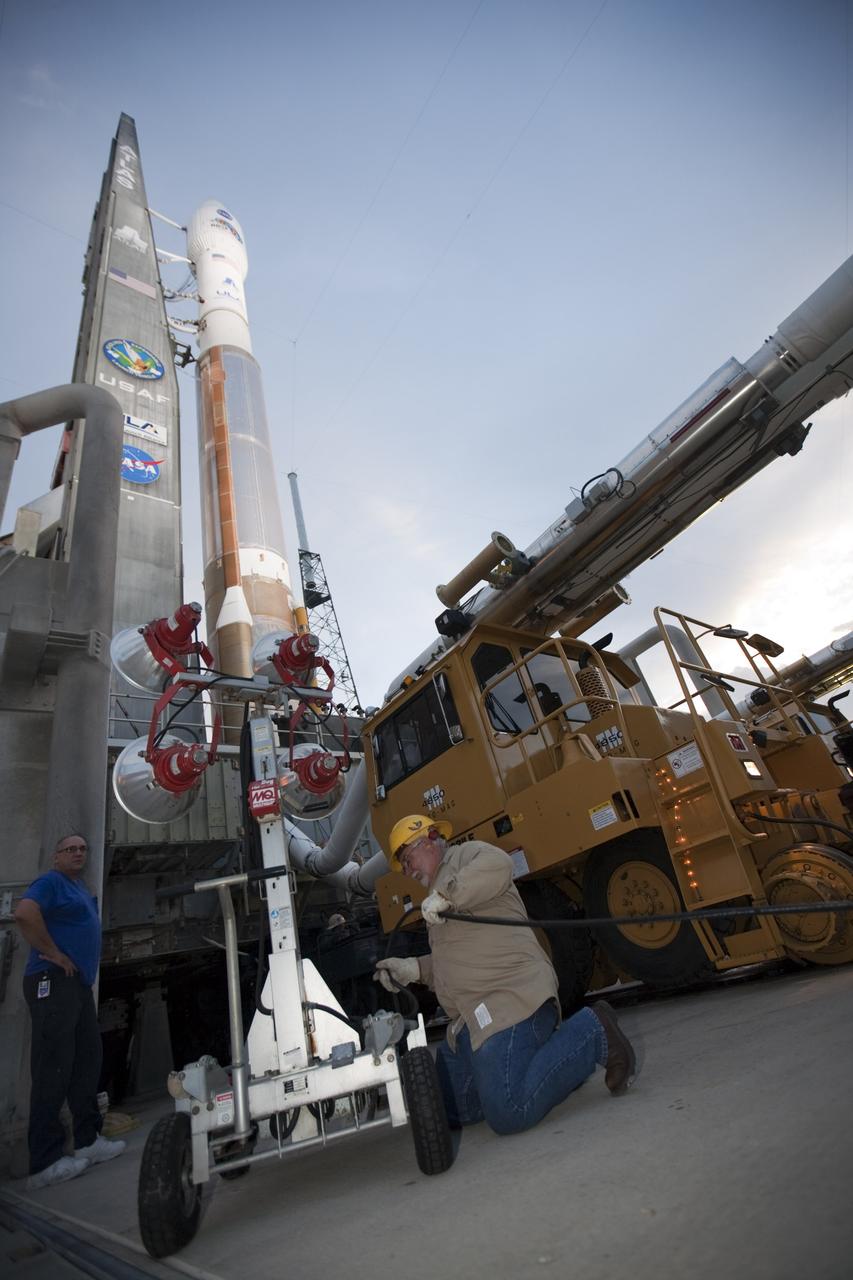 CAPE CANAVERAL, Fla. – At Cape Canaveral Air Force Station in Florida, United Launch Alliance, or ULA, technicians prepare the ULA Atlas V rocket, carrying NASA’s twin Radiation Belt Storm Probes, or RBSP, for rollback from Space Launch Complex 41 to the Vertical Integration Facility. The rocket and spacecraft will be secured and protected from inclement weather due to Tropical Storm Isaac.    RBSP will explore changes in Earth's space environment caused by the sun -- known as "space weather" -- that can disable satellites, create power-grid failures and disrupt GPS service. The mission also will provide data on the fundamental radiation and particle acceleration processes throughout the universe. The launch is rescheduled for 4:05 a.m. EDT on Aug. 30, pending approval from the range.  For more information on RBSP, visit http://www.nasa.gov/rbsp.  Photo credit: NASA/Ben Smegelsky