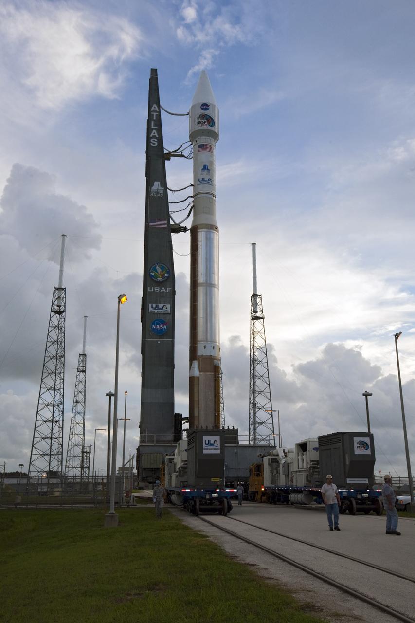CAPE CANAVERAL, Fla. – At Cape Canaveral Air Force Station in Florida, United Launch Alliance, or ULA, technicians monitor the progress as the ULA Atlas V rocket, carrying NASA’s twin Radiation Belt Storm Probes, or RBSP, rolls back from Space Launch Complex 41 to the Vertical Integration Facility. The rocket and spacecraft will be secured and protected from inclement weather due to Tropical Storm Isaac.     RBSP will explore changes in Earth's space environment caused by the sun -- known as "space weather" -- that can disable satellites, create power-grid failures and disrupt GPS service. The mission also will provide data on the fundamental radiation and particle acceleration processes throughout the universe. The launch is rescheduled for 4:05 a.m. EDT on Aug. 30, pending approval from the range.  For more information on RBSP, visit http://www.nasa.gov/rbsp.  Photo credit: NASA/Ben Smegelsky