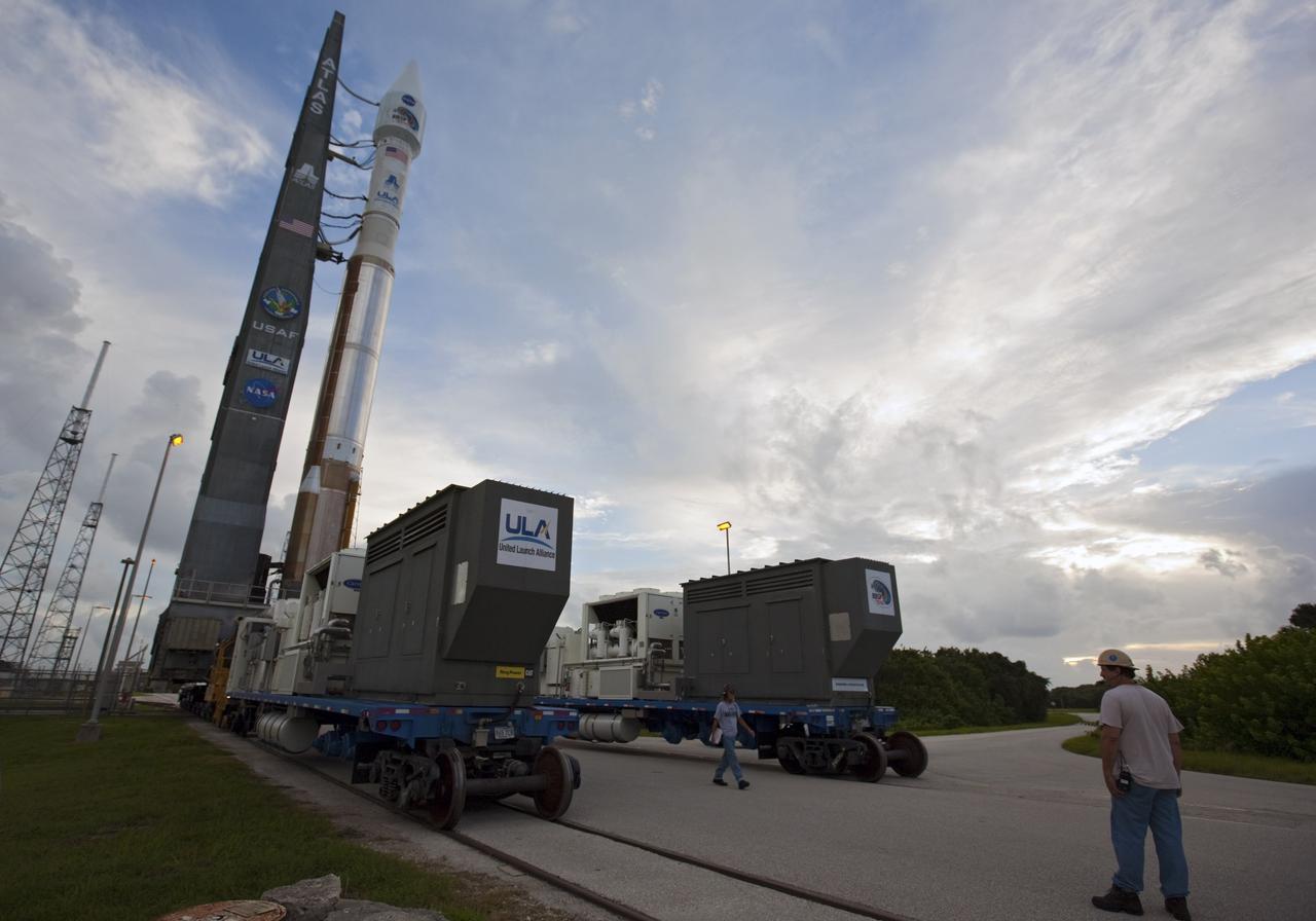 CAPE CANAVERAL, Fla. – At Cape Canaveral Air Force Station in Florida, United Launch Alliance, or ULA, technicians monitor the progress as the ULA Atlas V rocket, carrying NASA’s twin Radiation Belt Storm Probes, or RBSP, rolls back from Space Launch Complex 41 to the Vertical Integration Facility. The rocket and spacecraft will be secured and protected from inclement weather due to Tropical Storm Isaac.     RBSP will explore changes in Earth's space environment caused by the sun -- known as "space weather" -- that can disable satellites, create power-grid failures and disrupt GPS service. The mission also will provide data on the fundamental radiation and particle acceleration processes throughout the universe. The launch is rescheduled for 4:05 a.m. EDT on Aug. 30, pending approval from the range.  For more information on RBSP, visit http://www.nasa.gov/rbsp.  Photo credit: NASA/Ben Smegelsky