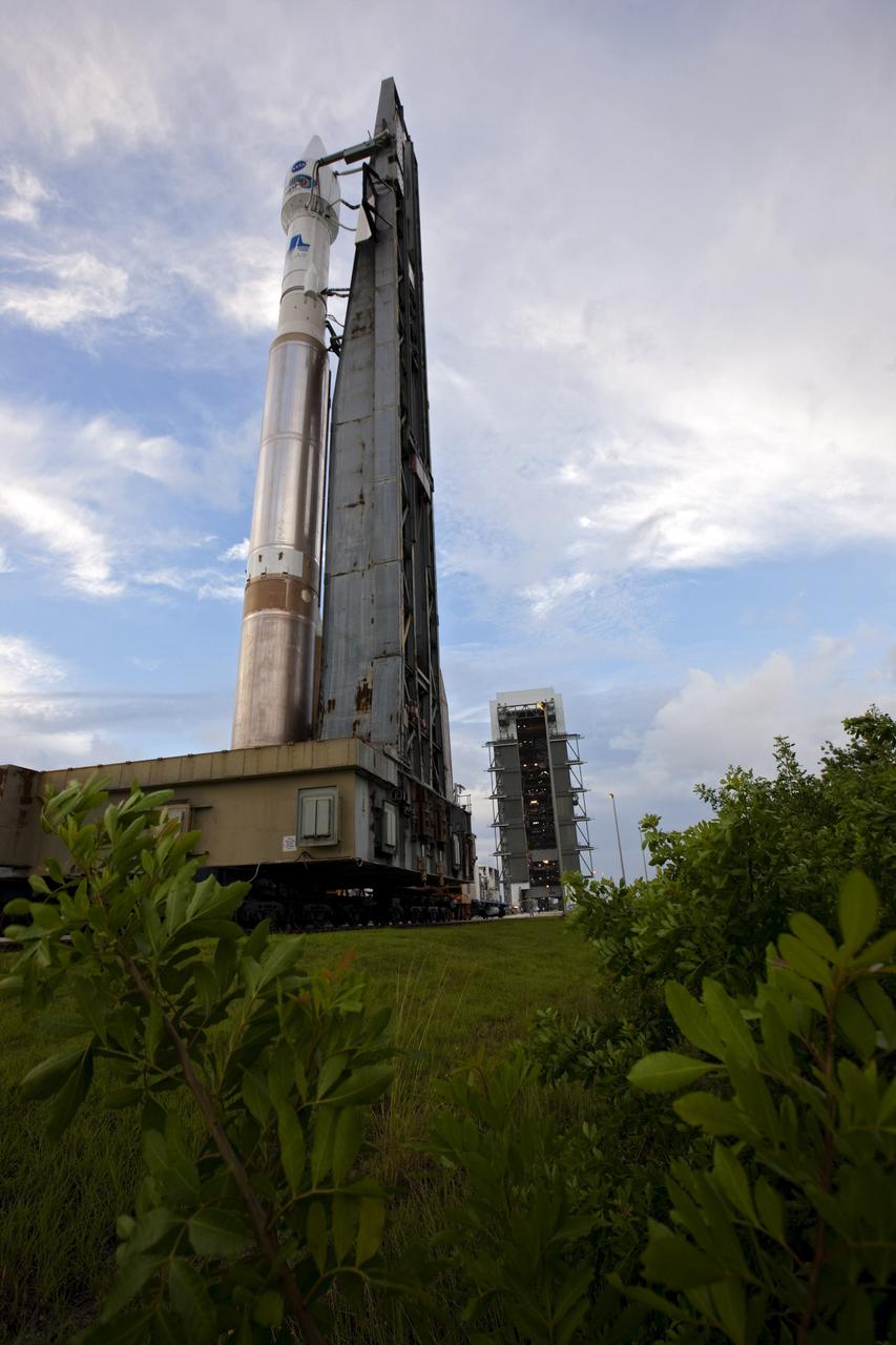 CAPE CANAVERAL, Fla. – At Cape Canaveral Air Force Station in Florida, the United Launch Alliance Atlas V rocket, carrying NASA’s twin Radiation Belt Storm Probes, or RBSP, is rolled back from Space Launch Complex 41 to the Vertical Integration Facility. The rocket and spacecraft will be secured and protected from inclement weather due to Tropical Storm Isaac.     RBSP will explore changes in Earth's space environment caused by the sun -- known as "space weather" -- that can disable satellites, create power-grid failures and disrupt GPS service. The mission also will provide data on the fundamental radiation and particle acceleration processes throughout the universe. The launch is rescheduled for 4:05 a.m. EDT on Aug. 30, pending approval from the range.  For more information on RBSP, visit http://www.nasa.gov/rbsp.  Photo credit: NASA/Ben Smegelsky