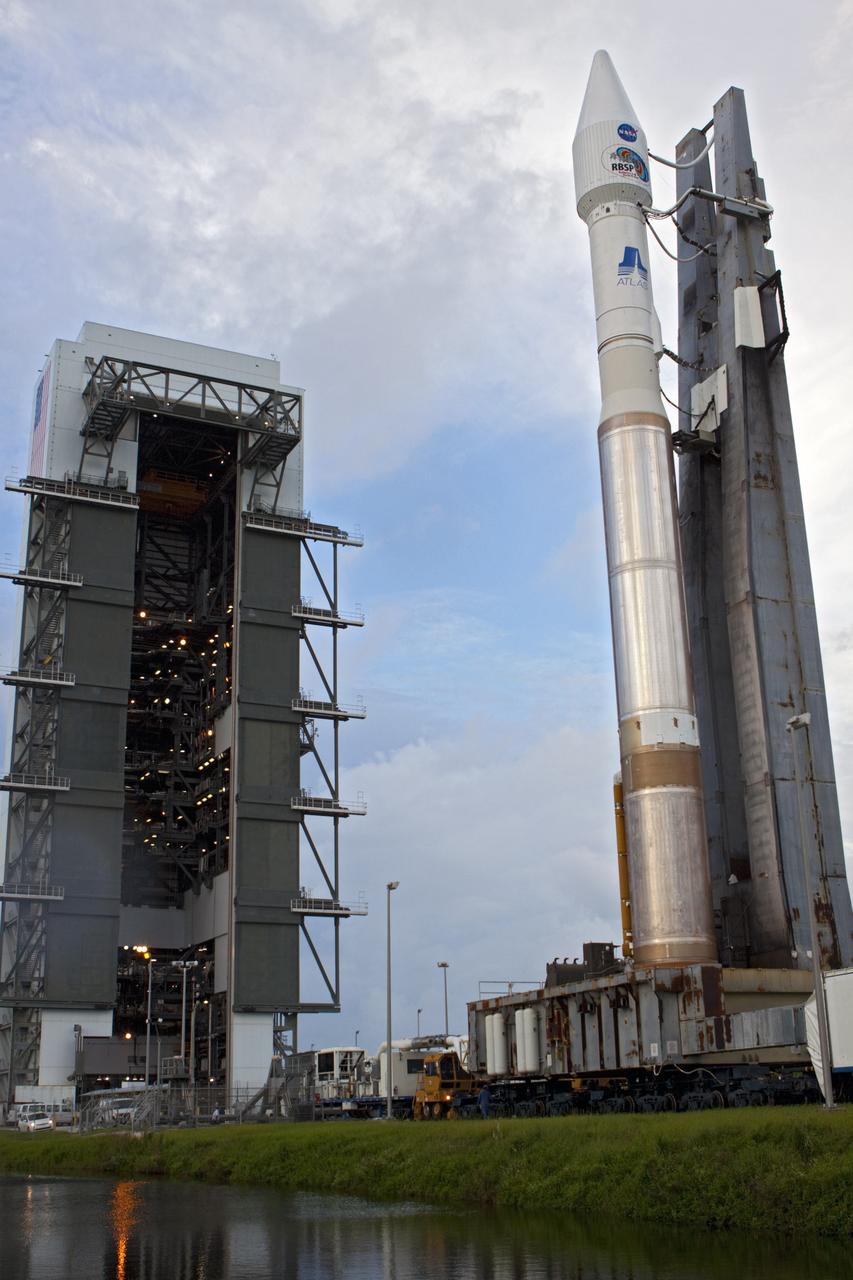 CAPE CANAVERAL, Fla. – At Cape Canaveral Air Force Station in Florida, the United Launch Alliance, or ULA, Atlas V rocket with NASA’s twin Radiation Belt Storm Probes, or RBSP, rolls back to the Vertical Integration Facility from Space Launch Complex 41. The rocket and spacecraft will be secured and protected from inclement weather due to Tropical Storm Isaac.     RBSP will explore changes in Earth's space environment caused by the sun -- known as "space weather" -- that can disable satellites, create power-grid failures and disrupt GPS service. The mission also will provide data on the fundamental radiation and particle acceleration processes throughout the universe. The launch is rescheduled for 4:05 a.m. EDT on Aug. 30, pending approval from the range.  For more information on RBSP, visit http://www.nasa.gov/rbsp.  Photo credit: NASA/Ben Smegelsky