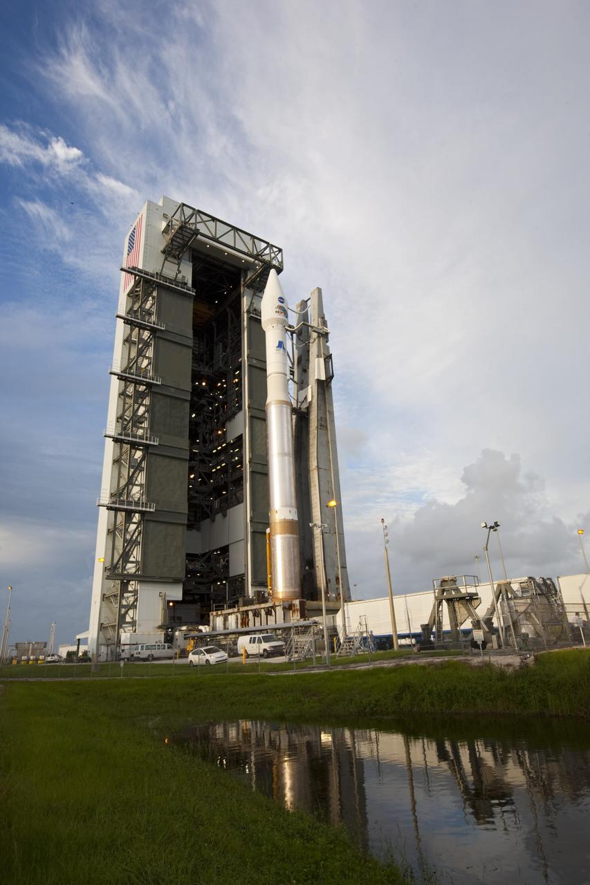 CAPE CANAVERAL, Fla. – At Cape Canaveral Air Force Station in Florida, the United Launch Alliance, or ULA, Atlas V rocket with NASA’s twin Radiation Belt Storm Probes, or RBSP, rolls back to the Vertical Integration Facility from Space Launch Complex 41. The rocket and spacecraft will be secured and protected from inclement weather due to Tropical Storm Isaac.     RBSP will explore changes in Earth's space environment caused by the sun -- known as "space weather" -- that can disable satellites, create power-grid failures and disrupt GPS service. The mission also will provide data on the fundamental radiation and particle acceleration processes throughout the universe. The launch is rescheduled for 4:05 a.m. EDT on Aug. 30, pending approval from the range.  For more information on RBSP, visit http://www.nasa.gov/rbsp.  Photo credit: NASA/Ben Smegelsky