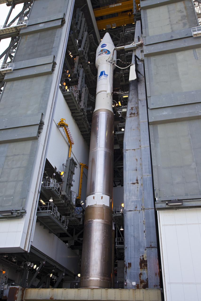 CAPE CANAVERAL, Fla. – At Cape Canaveral Air Force Station in Florida, the United Launch Alliance, or ULA, Atlas V rocket carrying NASA’s twin Radiation Belt Storm Probes, or RBSP, is inside the ULA Vertical Integration Facility at Space Launch Complex 41 before it begins rollout to the launch pad. The Atlas V rocket had been rolled back to the facility on August 26 to ensure the launch vehicle and RBSP spacecraft were secured and protected from inclement weather caused by Tropical Storm Isaac.    RBSP will explore changes in Earth's space environment caused by the sun -- known as "space weather" -- that can disable satellites, create power-grid failures and disrupt GPS service. The mission also will provide data on the fundamental radiation and particle acceleration processes throughout the universe. The launch is rescheduled for 4:05 a.m. EDT on Aug. 30. For more information on RBSP, visit http://www.nasa.gov/rbsp.  Photo credit: NASA/Kim Shiflett