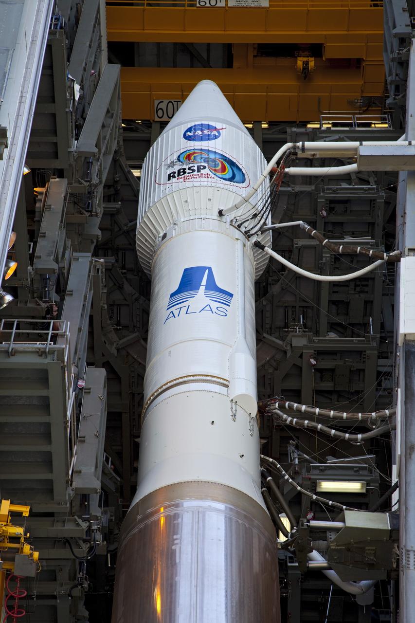 CAPE CANAVERAL, Fla. – At Cape Canaveral Air Force Station in Florida, the United Launch Alliance, or ULA, Atlas V rocket carrying NASA’s twin Radiation Belt Storm Probes, or RBSP, is inside the ULA Vertical Integration Facility at Space Launch Complex 41 before it begins rollout to the launch pad. The Atlas V rocket had been rolled back to the facility on August 26 to ensure the launch vehicle and RBSP spacecraft were secured and protected from inclement weather caused by Tropical Storm Isaac.    RBSP will explore changes in Earth's space environment caused by the sun -- known as "space weather" -- that can disable satellites, create power-grid failures and disrupt GPS service. The mission also will provide data on the fundamental radiation and particle acceleration processes throughout the universe. The launch is rescheduled for 4:05 a.m. EDT on Aug. 30. For more information on RBSP, visit http://www.nasa.gov/rbsp.  Photo credit: NASA/Kim Shiflett