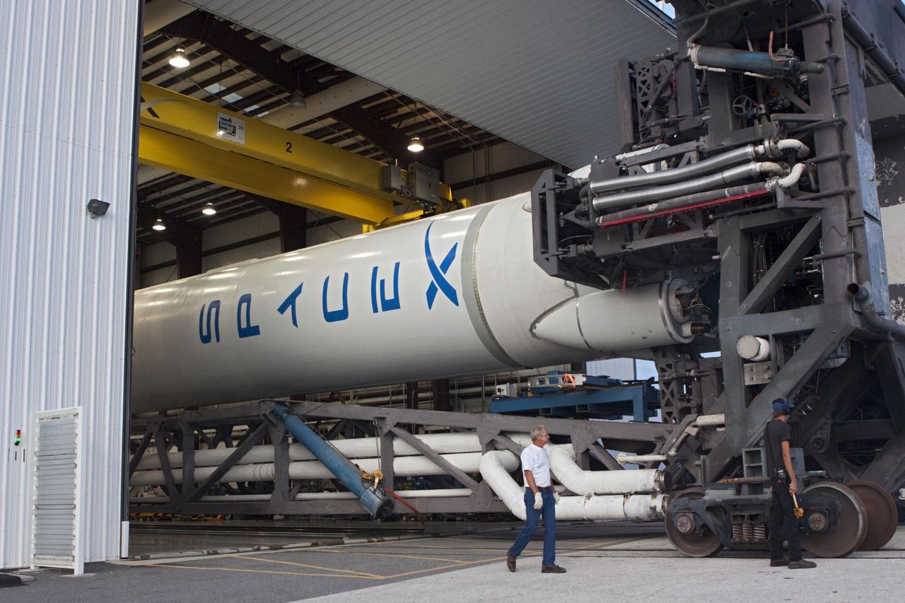 CAPE CANAVERAL, Fla. -- The Space Exploration Technologies, or SpaceX, Falcon 9 rocket rolls out of its processing hangar toward Space Launch Complex 40 at Cape Canaveral Air Force Station in Florida for a wet dress rehearsal. During the rehearsal, the rocket will be fully fueled and launch controllers will perform a countdown demonstration. The rehearsal is in preparation for the company's first Commercial Resupply Services, or CRS, mission to the International Space Station aboard the Dragon capsule.   The SpaceX CRS contract with NASA provides for 12 cargo resupply missions to the station through 2015, the first of which is targeted to launch in October 2012.SpaceX became the first private company to berth a spacecraft with the space station in 2012 during its final demonstration flight under the Commercial Orbital Transportation Services, or COTS, program managed by NASA's Johnson Space Center in Houston. Photo credit: NASA/Jim Grossmann