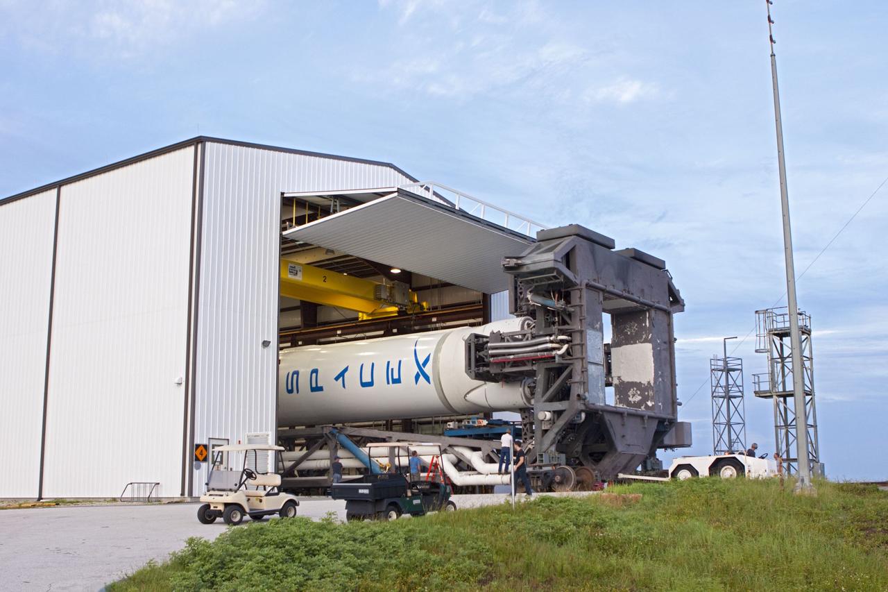 CAPE CANAVERAL, Fla. -- The Space Exploration Technologies, or SpaceX, Falcon 9 rocket rolls out of its processing hangar toward Space Launch Complex 40 at Cape Canaveral Air Force Station in Florida for a wet dress rehearsal. During the rehearsal, the rocket will be fully fueled and launch controllers will perform a countdown demonstration. The rehearsal is in preparation for the company's first Commercial Resupply Services, or CRS, mission to the International Space Station aboard the Dragon capsule. The SpaceX CRS contract with NASA provides for 12 cargo resupply missions to the station through 2015, the first of which is targeted to launch in October 2012.SpaceX became the first private company to berth a spacecraft with the space station in 2012 during its final demonstration flight under the Commercial Orbital Transportation Services, or COTS, program managed by NASA's Johnson Space Center in Houston. Photo credit: NASA/Jim Grossmann