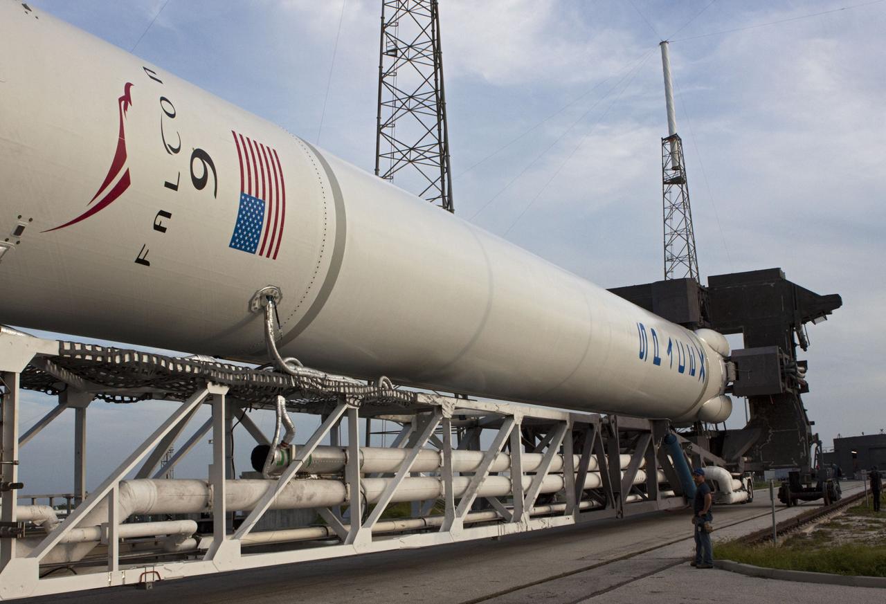 CAPE CANAVERAL, Fla. -- The Space Exploration Technologies, or SpaceX, Falcon 9 rocket rolls out of its processing hangar toward Space Launch Complex 40 at Cape Canaveral Air Force Station in Florida for a wet dress rehearsal. During the rehearsal, the rocket will be fully fueled and launch controllers will perform a countdown demonstration. The rehearsal is in preparation for the company's first Commercial Resupply Services, or CRS, mission to the International Space Station aboard the Dragon capsule.   The SpaceX CRS contract with NASA provides for 12 cargo resupply missions to the station through 2015, the first of which is targeted to launch in October 2012.SpaceX became the first private company to berth a spacecraft with the space station in 2012 during its final demonstration flight under the Commercial Orbital Transportation Services, or COTS, program managed by NASA's Johnson Space Center in Houston. Photo credit: NASA/Jim Grossmann