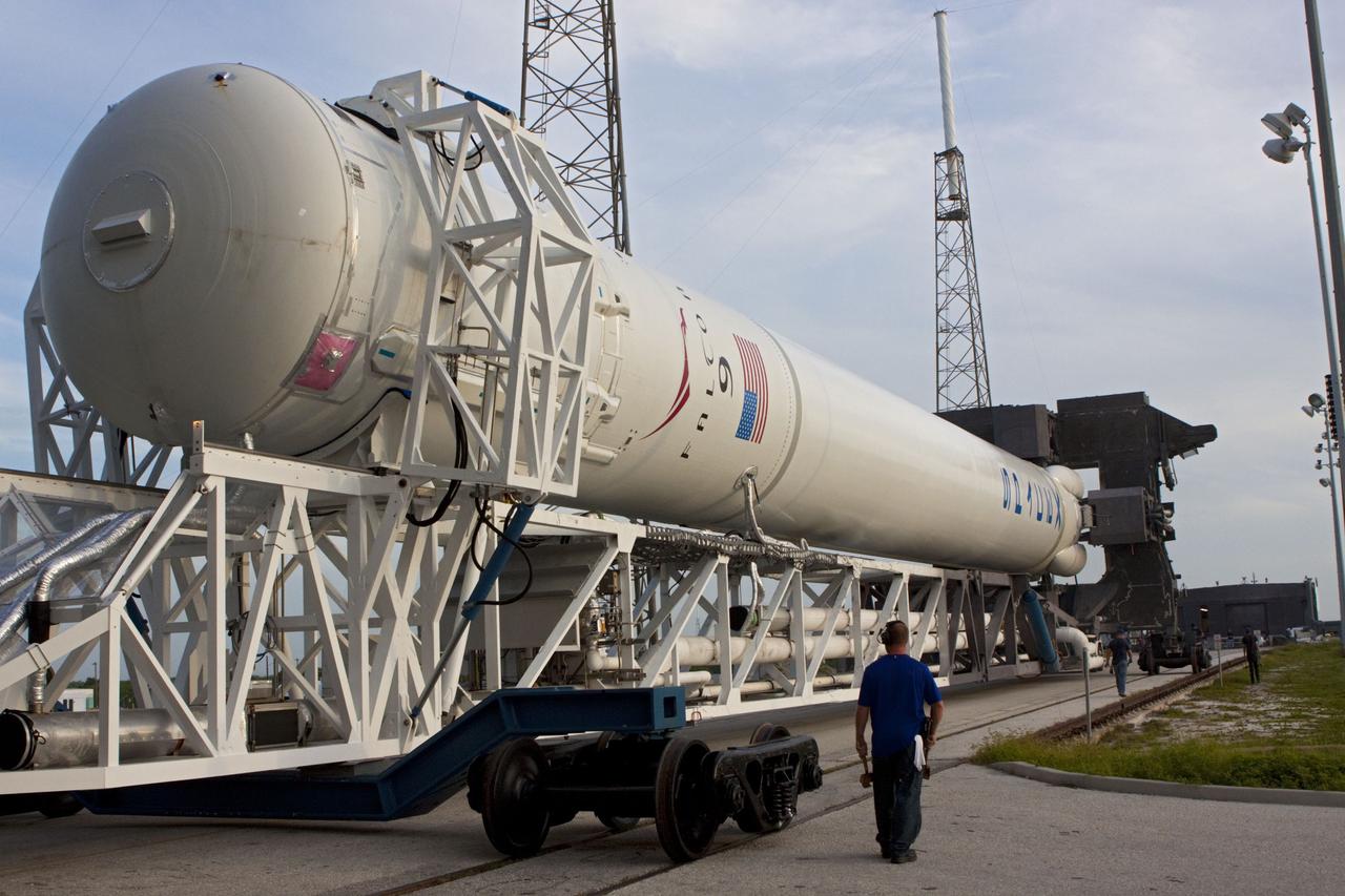CAPE CANAVERAL, Fla. -- The Space Exploration Technologies, or SpaceX, Falcon 9 rocket rolls out of its processing hangar toward Space Launch Complex 40 at Cape Canaveral Air Force Station in Florida for a wet dress rehearsal. During the rehearsal, the rocket will be fully fueled and launch controllers will perform a countdown demonstration. The rehearsal is in preparation for the company's first Commercial Resupply Services, or CRS, mission to the International Space Station aboard the Dragon capsule.         The SpaceX CRS contract with NASA provides for 12 cargo resupply missions to the station through 2015, the first of which is targeted to launch in October 2012.SpaceX became the first private company to berth a spacecraft with the space station in 2012 during its final demonstration flight under the Commercial Orbital Transportation Services, or COTS, program managed by NASA's Johnson Space Center in Houston. Photo credit: NASA/Jim Grossmann