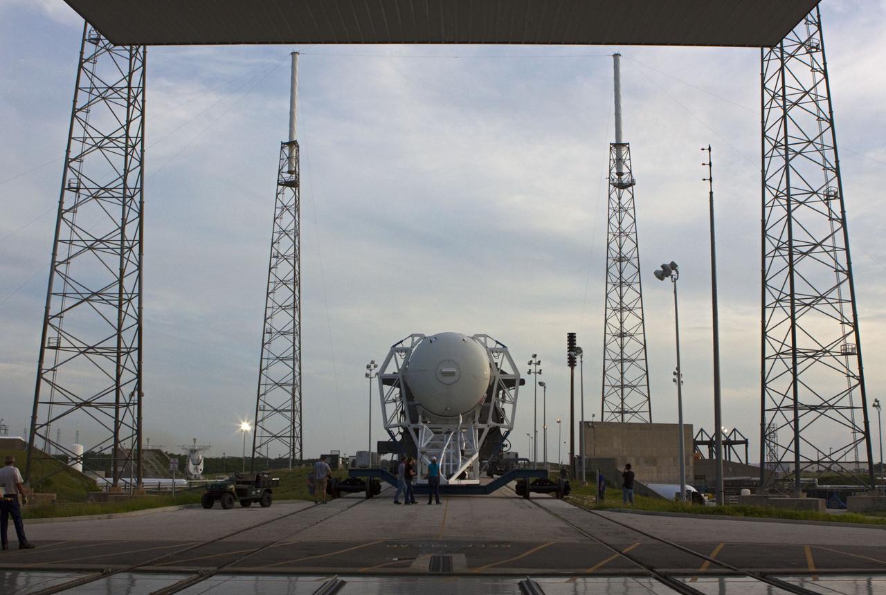 CAPE CANAVERAL, Fla. -- The Space Exploration Technologies, or SpaceX, Falcon 9 rocket rolls out of its processing hangar toward Space Launch Complex 40 at Cape Canaveral Air Force Station in Florida for a wet dress rehearsal. During the rehearsal, the rocket will be fully fueled and launch controllers will perform a countdown demonstration. The rehearsal is in preparation for the company's first Commercial Resupply Services, or CRS, mission to the International Space Station aboard the Dragon capsule.  The SpaceX CRS contract with NASA provides for 12 cargo resupply missions to the station through 2015, the first of which is targeted to launch in October 2012.SpaceX became the first private company to berth a spacecraft with the space station in 2012 during its final demonstration flight under the Commercial Orbital Transportation Services, or COTS, program managed by NASA's Johnson Space Center in Houston. Photo credit: NASA/Jim Grossmann