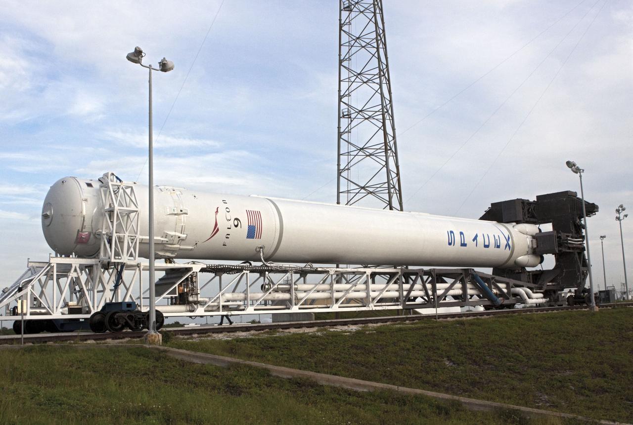 CAPE CANAVERAL, Fla. -- The Space Exploration Technologies, or SpaceX, Falcon 9 rocket rolls out of its processing hangar toward Space Launch Complex 40 at Cape Canaveral Air Force Station in Florida for a wet dress rehearsal. During the rehearsal, the rocket will be fully fueled and launch controllers will perform a countdown demonstration. The rehearsal is in preparation for the company's first Commercial Resupply Services, or CRS, mission to the International Space Station aboard the Dragon capsule.   The SpaceX CRS contract with NASA provides for 12 cargo resupply missions to the station through 2015, the first of which is targeted to launch in October 2012.SpaceX became the first private company to berth a spacecraft with the space station in 2012 during its final demonstration flight under the Commercial Orbital Transportation Services, or COTS, program managed by NASA's Johnson Space Center in Houston. Photo credit: NASA/Jim Grossmann