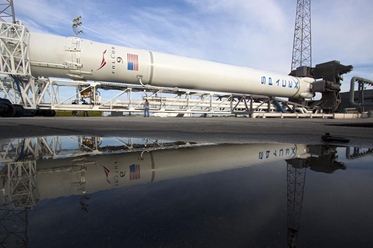CAPE CANAVERAL, Fla. -- The Space Exploration Technologies, or SpaceX, Falcon 9 rocket rolls out of its processing hangar toward Space Launch Complex 40 at Cape Canaveral Air Force Station in Florida for a wet dress rehearsal. During the rehearsal, the rocket will be fully fueled and launch controllers will perform a countdown demonstration. The rehearsal is in preparation for the company's first Commercial Resupply Services, or CRS, mission to the International Space Station aboard the Dragon capsule.   The SpaceX CRS contract with NASA provides for 12 cargo resupply missions to the station through 2015, the first of which is targeted to launch in October 2012.SpaceX became the first private company to berth a spacecraft with the space station in 2012 during its final demonstration flight under the Commercial Orbital Transportation Services, or COTS, program managed by NASA's Johnson Space Center in Houston. Photo credit: NASA/Jim Grossmann