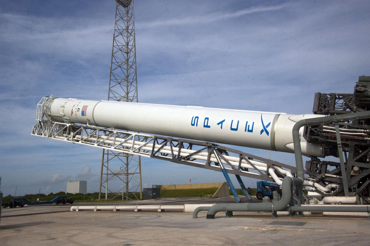 CAPE CANAVERAL, Fla. -- At Space Launch Complex 40 on Cape Canaveral Air Force Station in Florida, the Space Exploration Technologies, or SpaceX, Falcon 9 rocket is moved into a vertical position for a wet dress rehearsal. During the rehearsal, the rocket will be fully fueled and launch controllers will perform a countdown demonstration. The rehearsal is in preparation for the company's first Commercial Resupply Services, or CRS, mission to the International Space Station aboard the Dragon capsule.   The SpaceX CRS contract with NASA provides for 12 cargo resupply missions to the station through 2015, the first of which is targeted to launch in October 2012.SpaceX became the first private company to berth a spacecraft with the space station in 2012 during its final demonstration flight under the Commercial Orbital Transportation Services, or COTS, program managed by NASA's Johnson Space Center in Houston. Photo credit: NASA/Jim Grossmann