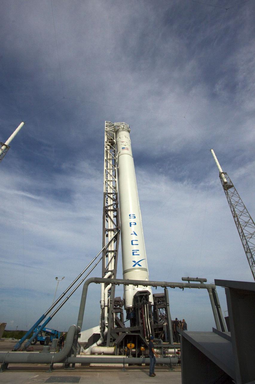 CAPE CANAVERAL, Fla. -- At Space Launch Complex 40 on Cape Canaveral Air Force Station in Florida, the Space Exploration Technologies, or SpaceX, Falcon 9 rocket is moved into a vertical position for a wet dress rehearsal. During the rehearsal, the rocket will be fully fueled and launch controllers will perform a countdown demonstration. The rehearsal is in preparation for the company's first Commercial Resupply Services, or CRS, mission to the International Space Station aboard the Dragon capsule.  The SpaceX CRS contract with NASA provides for 12 cargo resupply missions to the station through 2015, the first of which is targeted to launch in October 2012.SpaceX became the first private company to berth a spacecraft with the space station in 2012 during its final demonstration flight under the Commercial Orbital Transportation Services, or COTS, program managed by NASA's Johnson Space Center in Houston. Photo credit: NASA/Jim Grossmann
