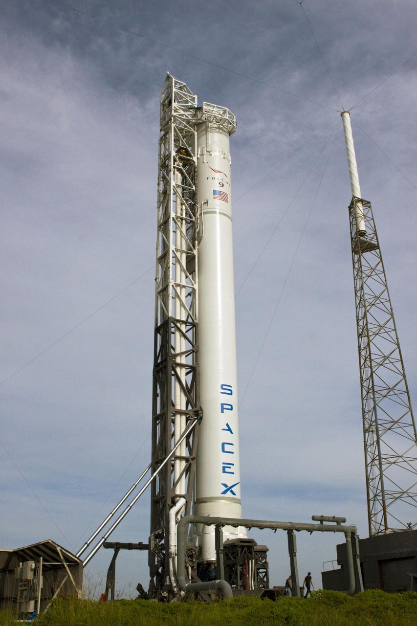 CAPE CANAVERAL, Fla. -- The Space Exploration Technologies, or SpaceX, Falcon 9 rocket is in position for a wet dress rehearsal at Space Launch Complex 40 at Cape Canaveral Air Force Station in Florida. During the rehearsal, the rocket will be fully fueled and launch controllers will perform a countdown demonstration. The rehearsal is in preparation for the company's first Commercial Resupply Services, or CRS, mission to the International Space Station aboard the Dragon capsule.   The SpaceX CRS contract with NASA provides for 12 cargo resupply missions to the station through 2015, the first of which is targeted to launch in October 2012.SpaceX became the first private company to berth a spacecraft with the space station in 2012 during its final demonstration flight under the Commercial Orbital Transportation Services, or COTS, program managed by NASA's Johnson Space Center in Houston. Photo credit: NASA/Jim Grossmann