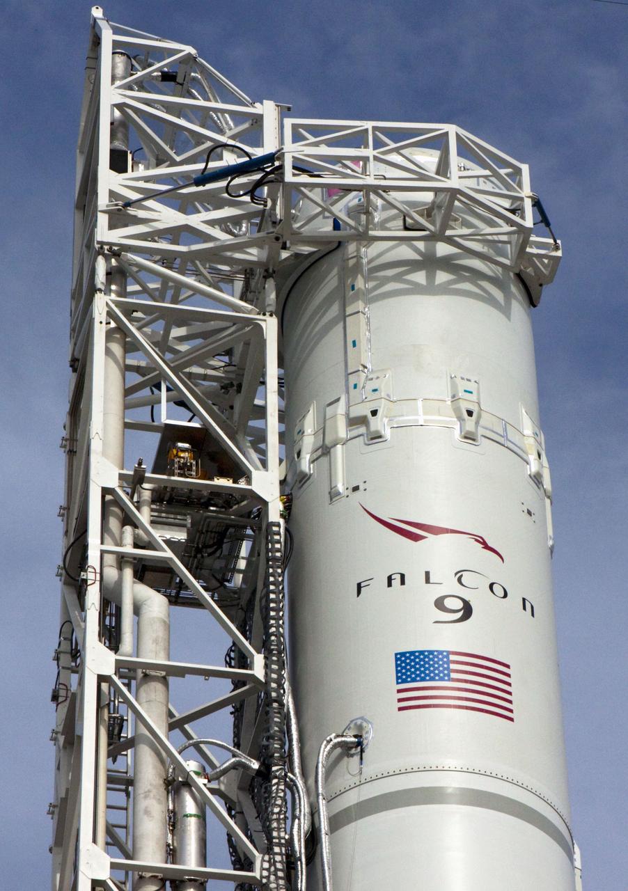 CAPE CANAVERAL, Fla. -- The Space Exploration Technologies, or SpaceX, Falcon 9 rocket is in position for a wet dress rehearsal at Space Launch Complex 40 at Cape Canaveral Air Force Station in Florida. During the rehearsal, the rocket will be fully fueled and launch controllers will perform a countdown demonstration. The rehearsal is in preparation for the company's first Commercial Resupply Services, or CRS, mission to the International Space Station aboard the Dragon capsule.   The SpaceX CRS contract with NASA provides for 12 cargo resupply missions to the station through 2015, the first of which is targeted to launch in October 2012.SpaceX became the first private company to berth a spacecraft with the space station in 2012 during its final demonstration flight under the Commercial Orbital Transportation Services, or COTS, program managed by NASA's Johnson Space Center in Houston. Photo credit: NASA/Jim Grossmann