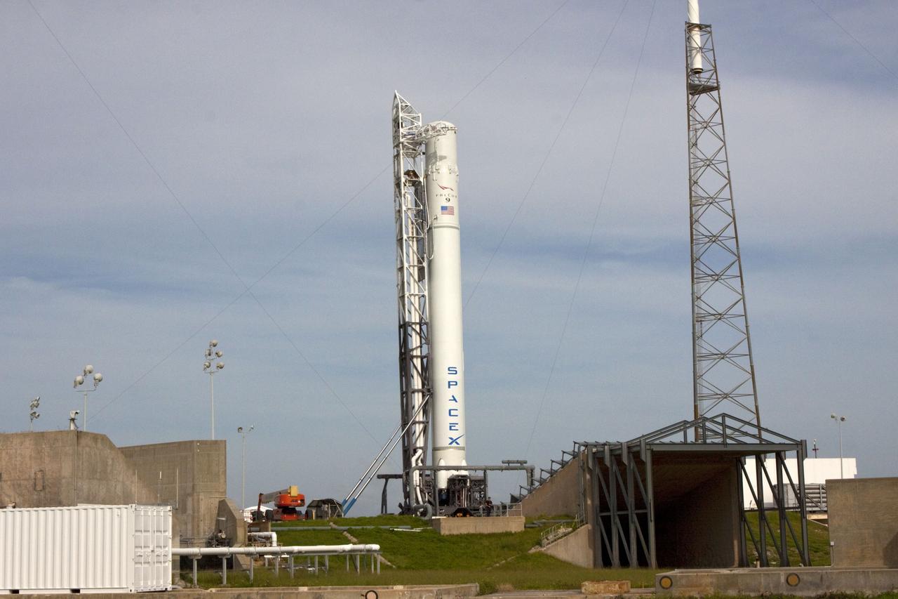 CAPE CANAVERAL, Fla. -- The Space Exploration Technologies, or SpaceX, Falcon 9 rocket is in position for a wet dress rehearsal at Space Launch Complex 40 at Cape Canaveral Air Force Station in Florida. During the rehearsal, the rocket will be fully fueled and launch controllers will perform a countdown demonstration. The rehearsal is in preparation for the company's first Commercial Resupply Services, or CRS, mission to the International Space Station aboard the Dragon capsule. The SpaceX CRS contract with NASA provides for 12 cargo resupply missions to the station through 2015, the first of which is targeted to launch in October 2012.SpaceX became the first private company to berth a spacecraft with the space station in 2012 during its final demonstration flight under the Commercial Orbital Transportation Services, or COTS, program managed by NASA's Johnson Space Center in Houston. Photo credit: NASA/Jim Grossmann