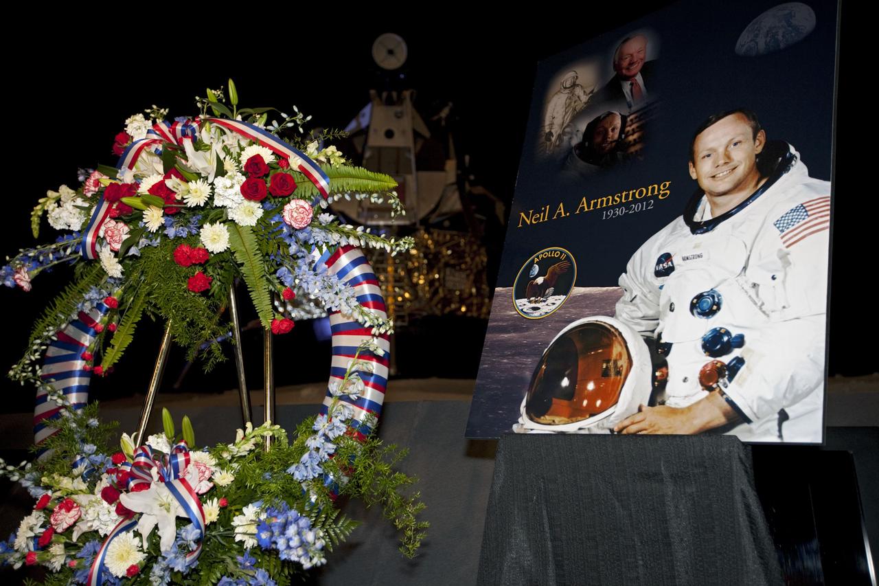 CAPE CANAVERAL, Fla. - Kennedy Space Center employees and guests gathered for a brief ceremony on Aug. 31, 2012 honoring Neil Armstrong, who died Aug. 25, 2012 at the age of 82. Armstrong was hailed by Center Director Bob Cabana as one of our heroes and a truly a great American. Cabana placed a wreath in the spaceport's Apollo-Saturn V Center.      Selected as an astronaut in 1962, Neil Armstrong flew on NASA's Gemini 8 with David Scott in March 1966 and the first lunar landing mission, Apollo 11, with Mike Collins and Buzz Aldine in July 1969. On July 20, 1969, he became the first human to walk on the moon. For more information, visit: http://www.nasa.gov/centers/kennedy/news/neil_armstrong.html Photo credit: NASA/Kim Shiflett