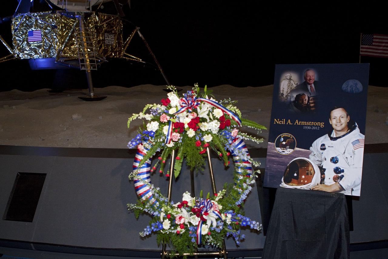 CAPE CANAVERAL, Fla. - Kennedy Space Center employees and guests gathered for a brief ceremony on Aug. 31, 2012 honoring Neil Armstrong, who died Aug. 25, 2012 at the age of 82. Armstrong was hailed by Center Director Bob Cabana as one of our heroes and a truly a great American. Cabana placed a wreath near a replica lunar module at the spaceport's Apollo-Saturn V Center.      Selected as an astronaut in 1962, Neil Armstrong flew on NASA's Gemini 8 with David Scott in March 1966 and the first lunar landing mission, Apollo 11, with Mike Collins and Buzz Aldine in July 1969. On July 20, 1969, he became the first human to walk on the moon. For more information, visit: http://www.nasa.gov/centers/kennedy/news/neil_armstrong.html Photo credit: NASA/Kim Shiflett