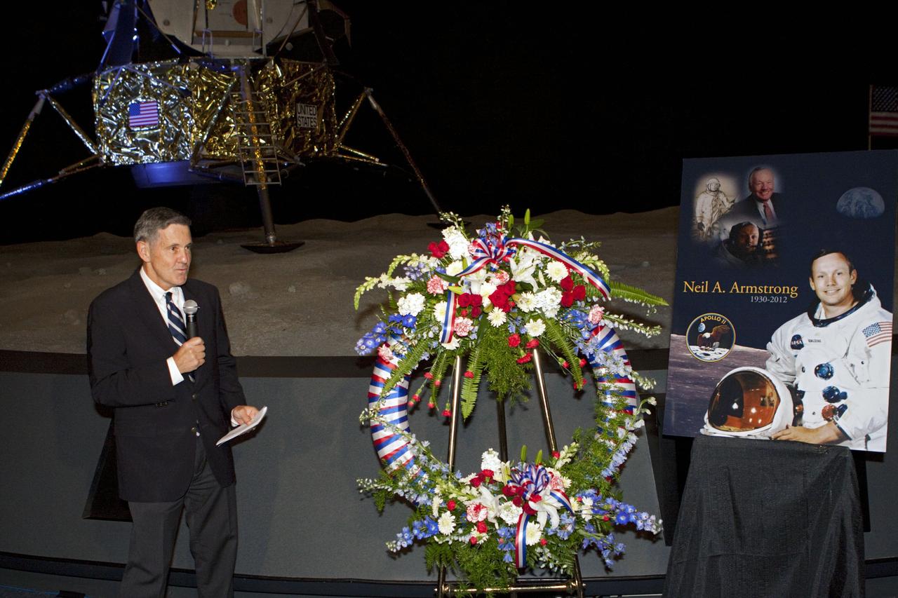 CAPE CANAVERAL, Fla. - Kennedy Space Center Director Bob Cabana spoke to spaceport employees and guests at a brief ceremony on Aug. 31, 2012 honoring Neil Armstrong, who died Aug. 25, 2012 at the age of 82. Armstrong was hailed by Cabana as one of our heroes and a truly a great American. Cabana, also a former astronaut, placed a wreath near a replica lunar module at the spaceport's Apollo-Saturn V Center.      Selected as an astronaut in 1962, Neil Armstrong flew on NASA's Gemini 8 with David Scott in March 1966 and the first lunar landing mission, Apollo 11, with Mike Collins and Buzz Aldine in July 1969. On July 20, 1969, he became the first human to walk on the moon. For more information, visit: http://www.nasa.gov/centers/kennedy/news/neil_armstrong.html Photo credit: NASA/Kim Shiflett