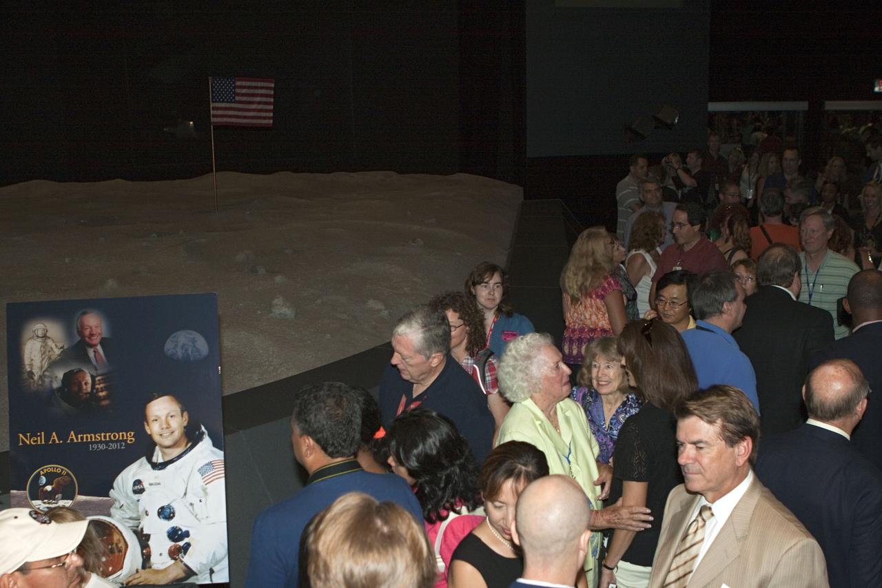CAPE CANAVERAL, Fla. - Kennedy Space Center employees and guests gathered for a brief ceremony on Aug. 31, 2012 honoring Neil Armstrong, who died Aug. 25, 2012 at the age of 82. Armstrong was hailed by Center Director Bob Cabana as one of our heroes and a truly a great American. Cabana placed a wreath in the spaceport's Apollo-Saturn V Center.      Selected as an astronaut in 1962, Neil Armstrong flew on NASA's Gemini 8 with David Scott in March 1966 and the first lunar landing mission, Apollo 11, with Mike Collins and Buzz Aldine in July 1969. On July 20, 1969, he became the first human to walk on the moon. For more information, visit: http://www.nasa.gov/centers/kennedy/news/neil_armstrong.html Photo credit: NASA/Kim Shiflett