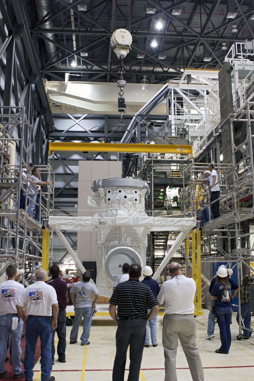 CAPE CANAVERAL, Fla. – At NASA's Kennedy Space Center in Florida, a mock air lock is prepared for installation in the payload bay of the space shuttle Atlantis in Bay 2 of the Orbiter Processing Facility. Atlantis is undergoing final preparations for its transfer to the Kennedy Space Center Visitor Complex targeted for November.      The work is part of Transition and Retirement of the remaining space shuttles, Atlantis and Endeavour. Atlantis is being prepared for public display at Kennedy's Visitor Complex. Over the course of its 26-year career, Atlantis spent 293 days in space during 33 missions. For more information, visit http://www.nasa.gov/transition Photo credit: NASA/Jim Grossmann