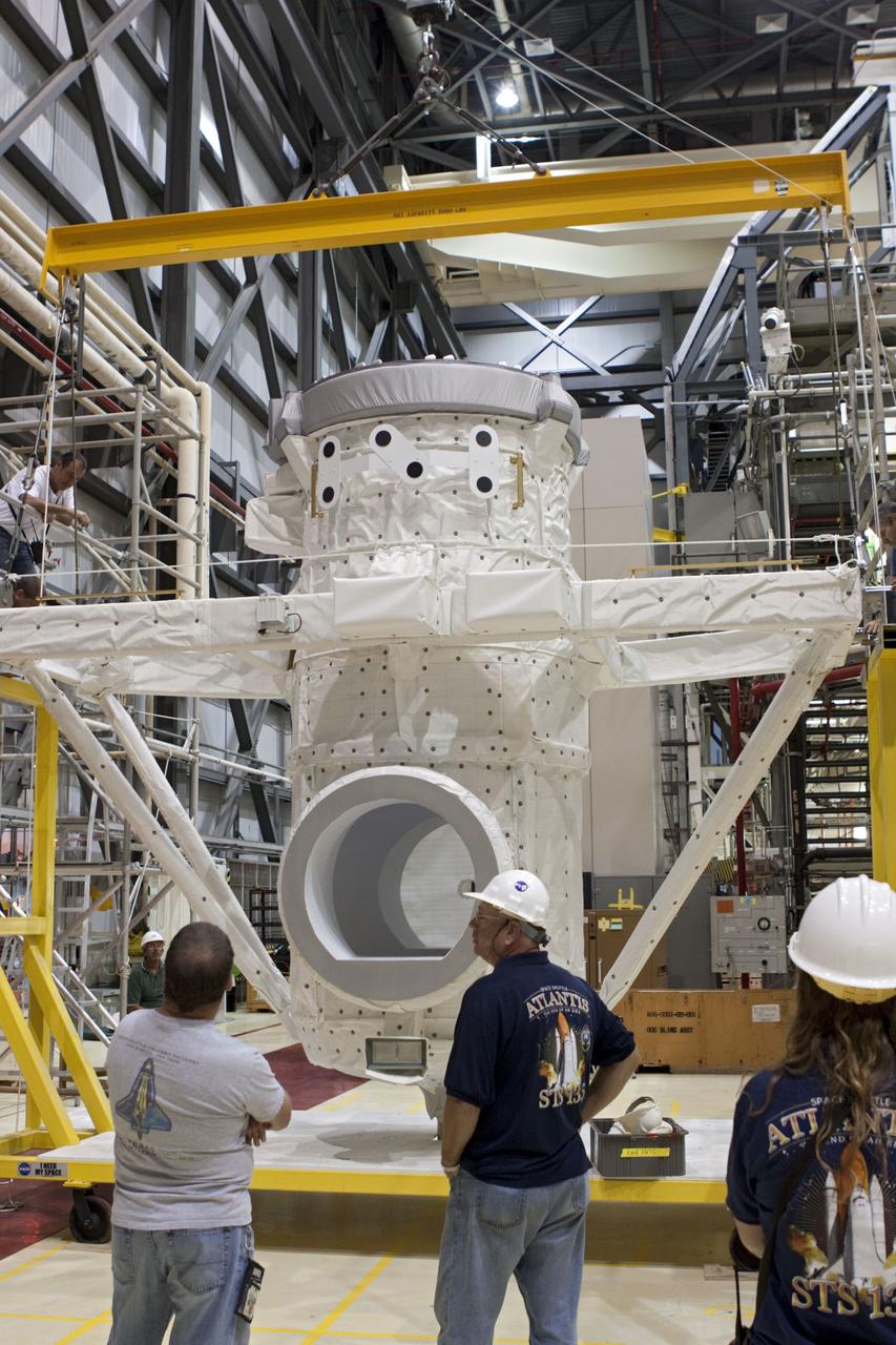 CAPE CANAVERAL, Fla. – At NASA's Kennedy Space Center in Florida, United Space Alliance technicians prepare a mock air lock for installation in the payload bay of the space shuttle Atlantis in Bay 2 of the Orbiter Processing Facility. Atlantis is undergoing final preparations for its transfer to the Kennedy Space Center Visitor Complex targeted for November.      The work is part of Transition and Retirement of the remaining space shuttles, Atlantis and Endeavour. Atlantis is being prepared for public display at Kennedy's Visitor Complex. Over the course of its 26-year career, Atlantis spent 293 days in space during 33 missions. For more information, visit http://www.nasa.gov/transition Photo credit: NASA/Jim Grossmann