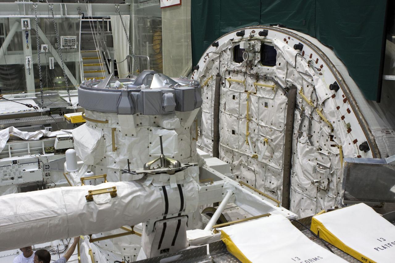 – CAPE CANAVERAL, Fla. – At NASA's Kennedy Space Center in Florida, a mock air lock has been installed in the payload bay of the space shuttle Atlantis in Bay 2 of the Orbiter Processing Facility. Atlantis is undergoing final preparations for its transfer to the Kennedy Space Center Visitor Complex targeted for November.      The work is part of Transition and Retirement of the remaining space shuttles, Atlantis and Endeavour. Atlantis is being prepared for public display at Kennedy's Visitor Complex. Over the course of its 26-year career, Atlantis spent 293 days in space during 33 missions. For more information, visit http://www.nasa.gov/transition Photo credit: NASA/Jim Grossmann