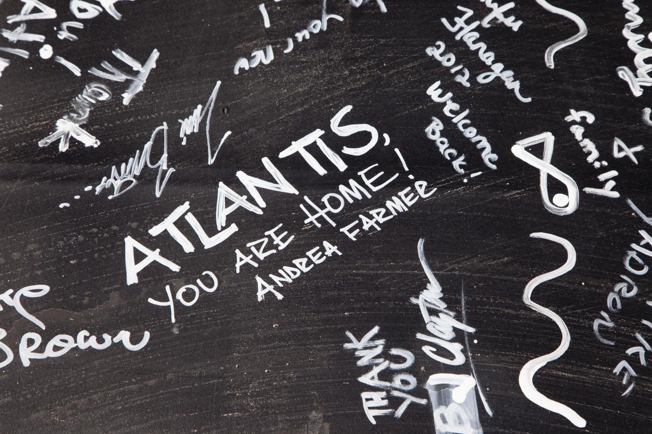 CAPE CANAVERAL, Fla. – Signatures on a steel beam that was placed at the highest point of a new exhibit facility under construction at the Kennedy Space Center Visitor Complex. The 90,000-square-foot facility will house space shuttle Atlantis and 62 shuttle program exhibits. Photo credit: NASA/Kim Shiflett