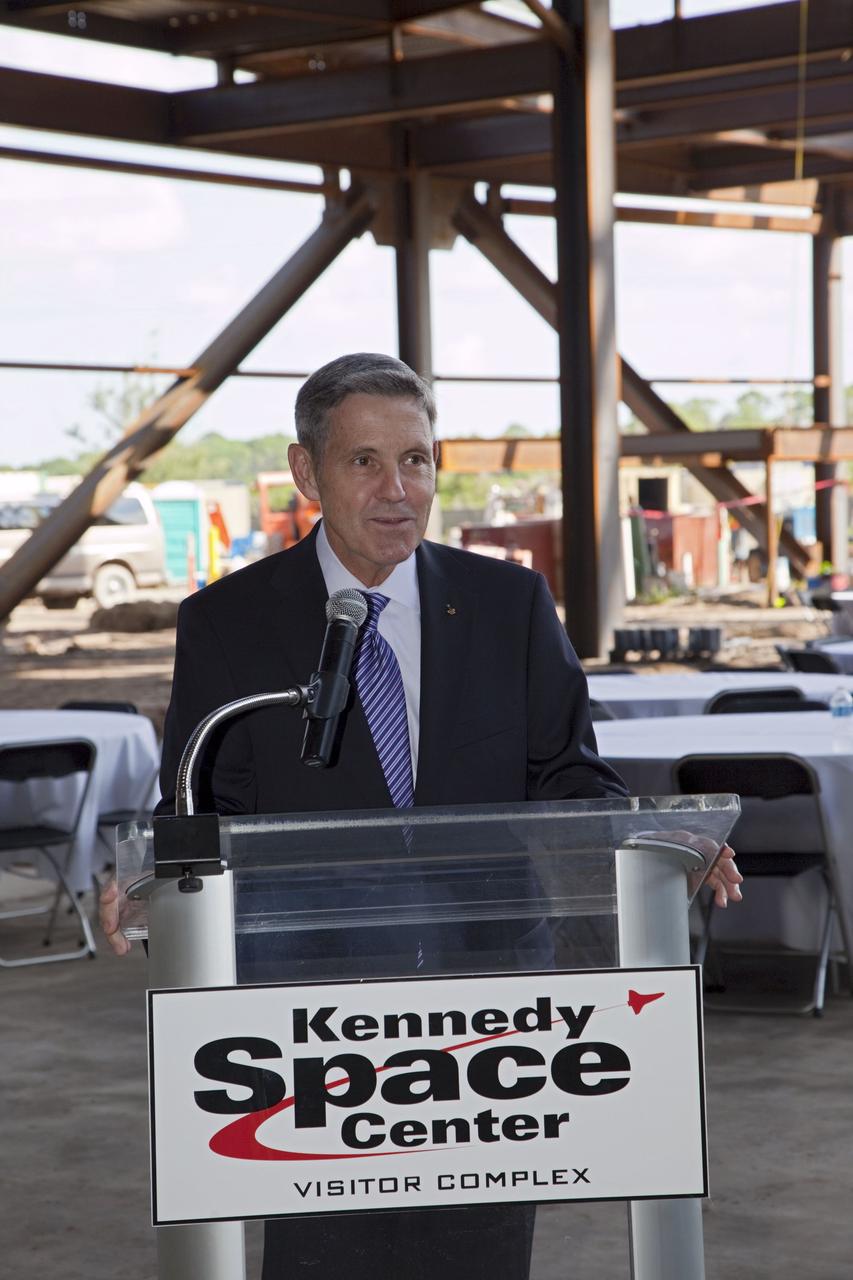 CAPE CANAVERAL, Fla. – Robert Cabana, Kennedy Space Center director and a former astronaut, speaks during a ceremony marking the placement of a steel beam at the highest point of a new exhibit facility under construction at the Kennedy Space Center Visitor Complex. The 90,000-square-foot facility will house space shuttle Atlantis and 62 shuttle program exhibits. Photo credit: NASA/Kim Shiflett
