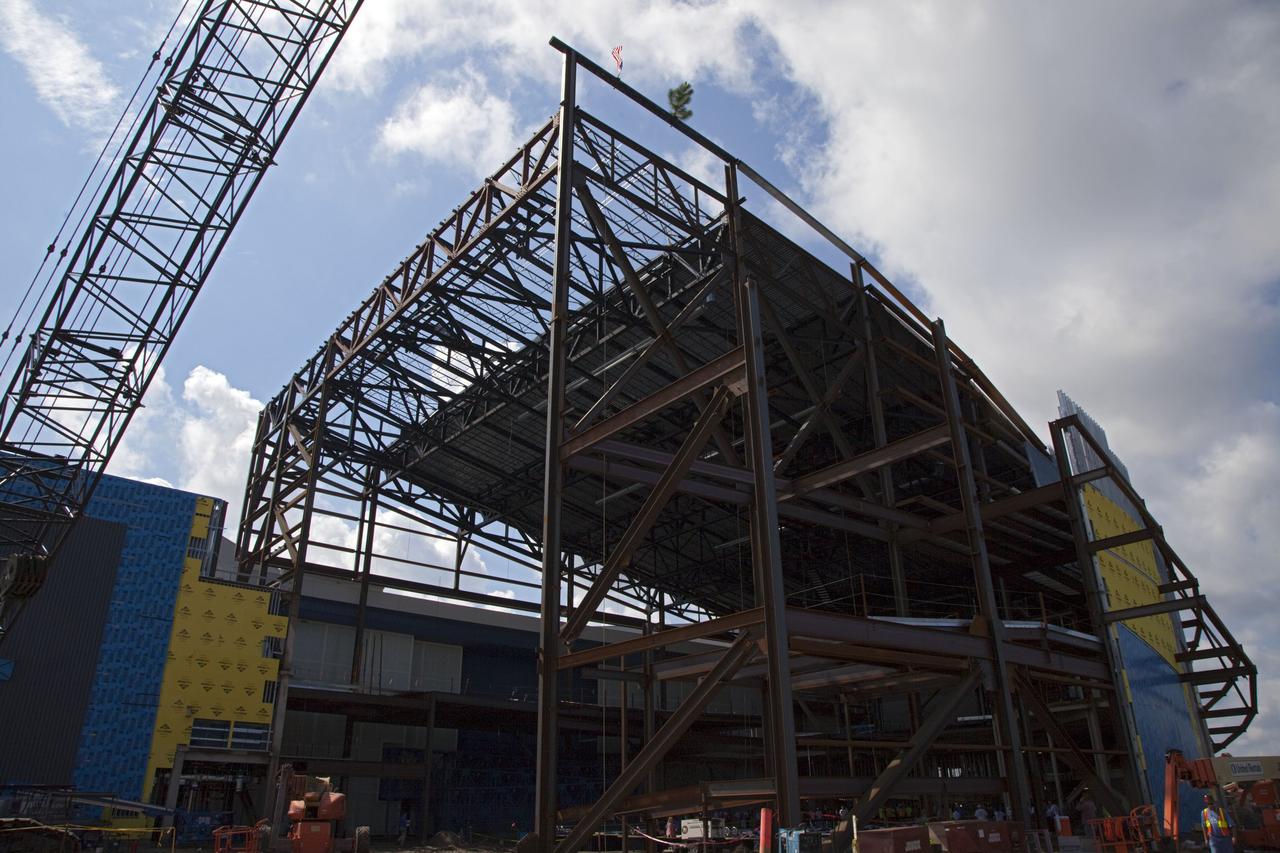 CAPE CANAVERAL, Fla. – A steel beam after being fitted to the highest point of a new exhibit facility under construction at the Kennedy Space Center Visitor Complex. The 90,000-square-foot facility will house space shuttle Atlantis and 62 shuttle program exhibits. Photo credit: NASA/Kim Shiflett