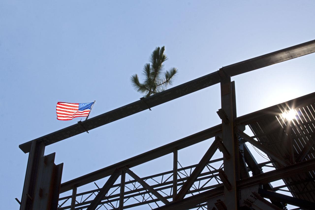 CAPE CANAVERAL, Fla. – A steel beam after being fitted to the highest point of a new exhibit facility under construction at the Kennedy Space Center Visitor Complex. The 90,000-square-foot facility will house space shuttle Atlantis and 62 shuttle program exhibits. Photo credit: NASA/Kim Shiflett