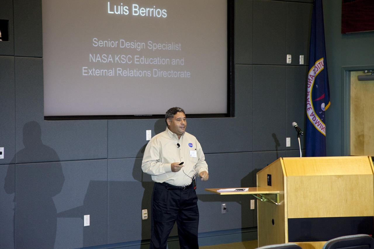 CAPE CANAVERAL, Fla. – Luis Berrios, senior design specialist at NASA's Kennedy Space Center, speaks during the center's Innovation Expo in the Operations Support Building II. The center-wide event gave researchers a chance to show some of their work to others at the center and gave employees the opportunity to see facilities they hadn't viewed before. Photo credit: Gianni Woods
